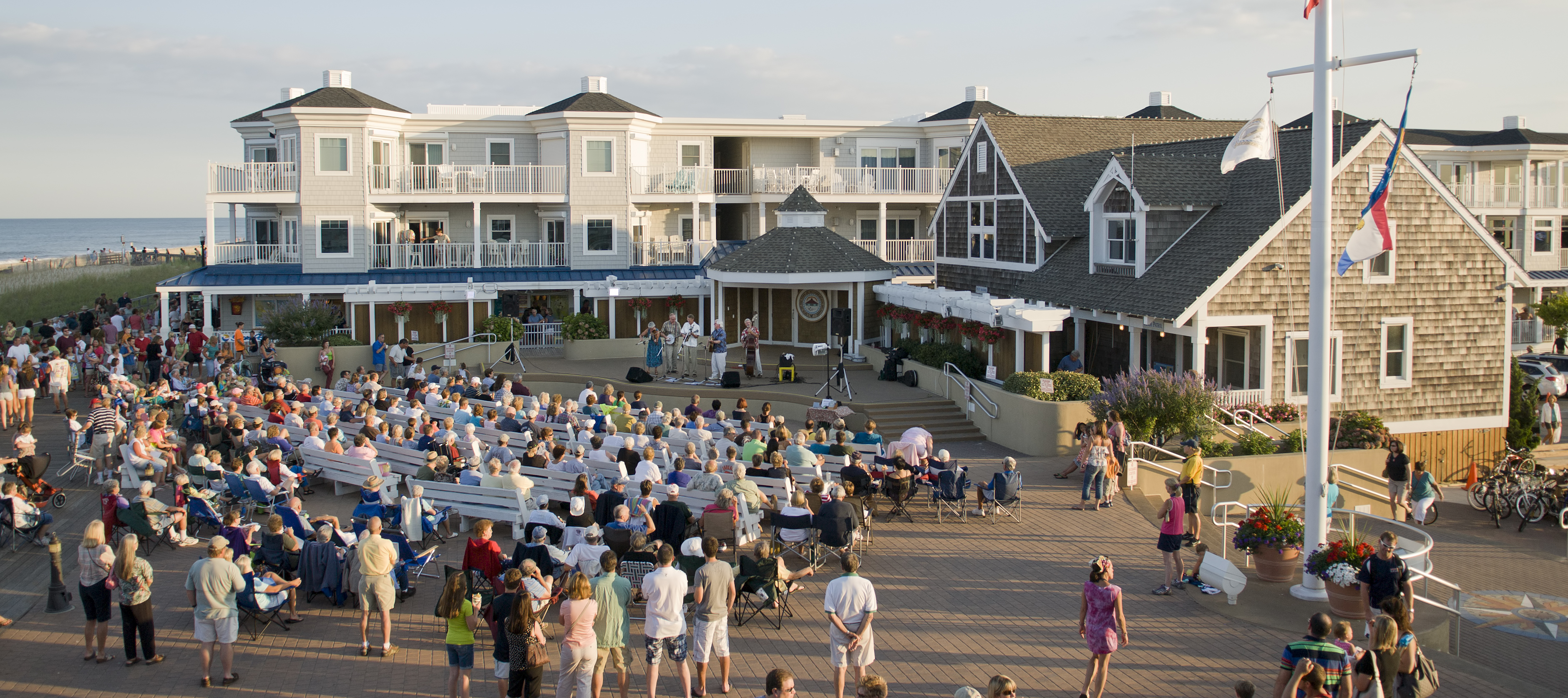 Aerial shot of evening concert at the bandstand on the boardwalk in Bethany Beach, Delaware, USA.