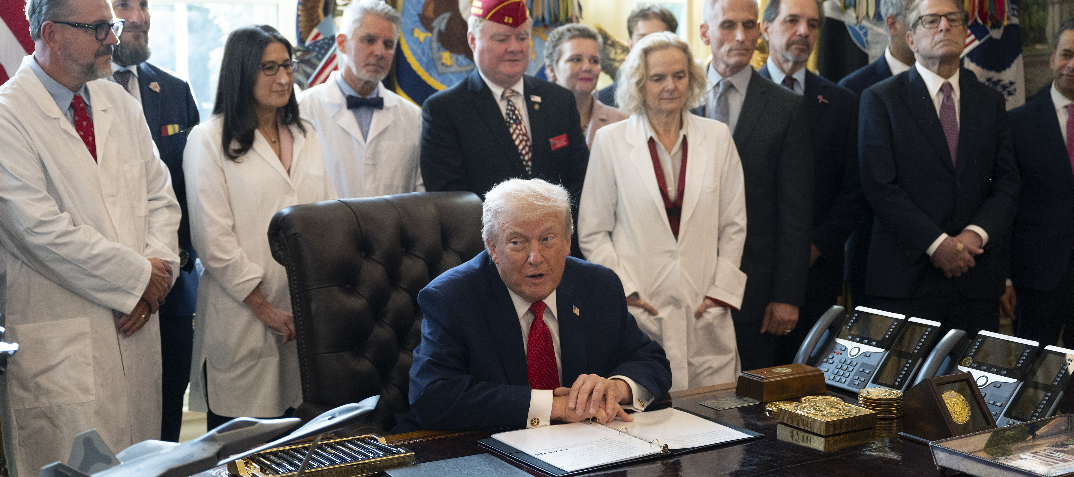 President Donald J. Trump signs an executive order expanding access to marijuana in the Oval office at the White House on December 18, 2025.