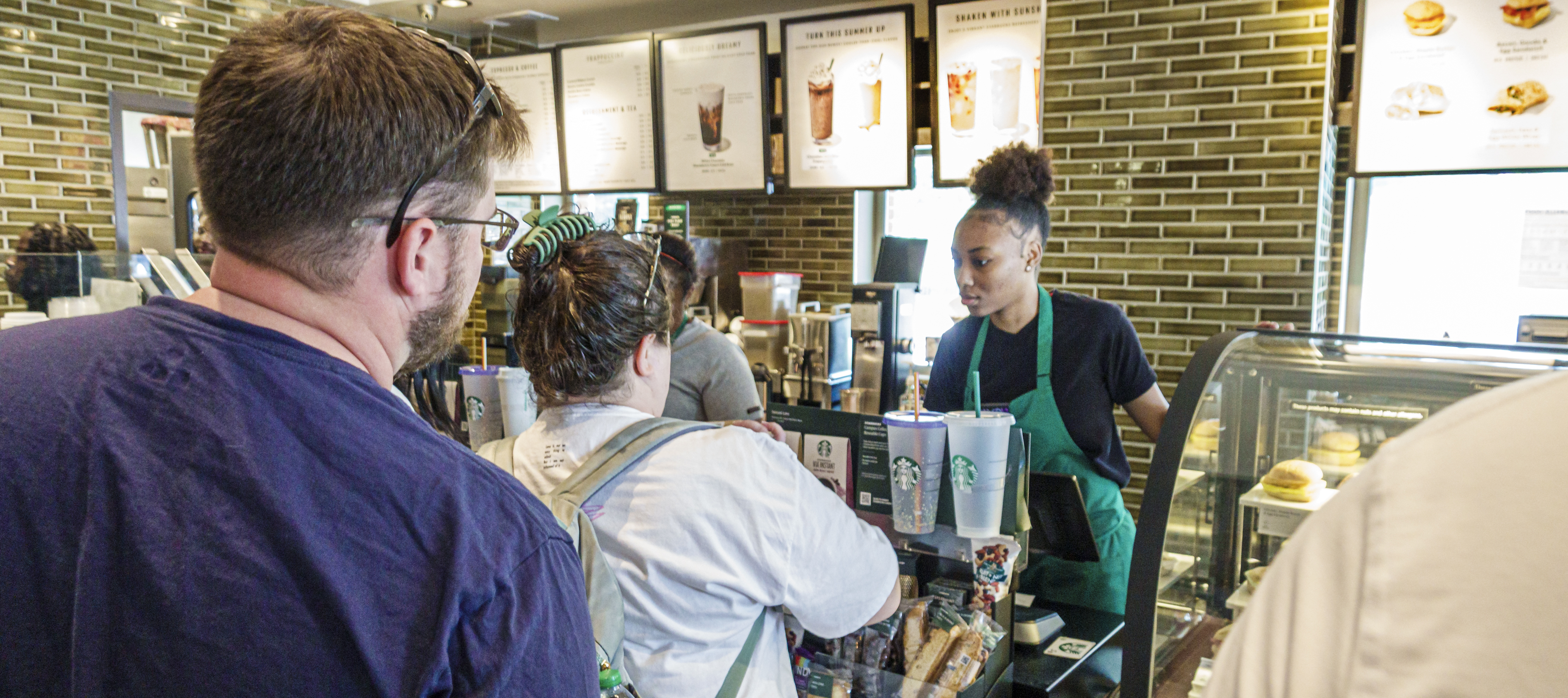 A barista serves customers at a Starbucks location in Atlanta, Georgia.