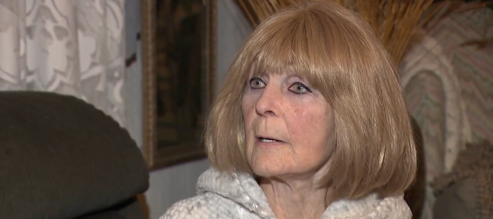 Cape Cod resident Joyce Michaud expresses frustration with the sudden taking of her home's deed for a construction project.