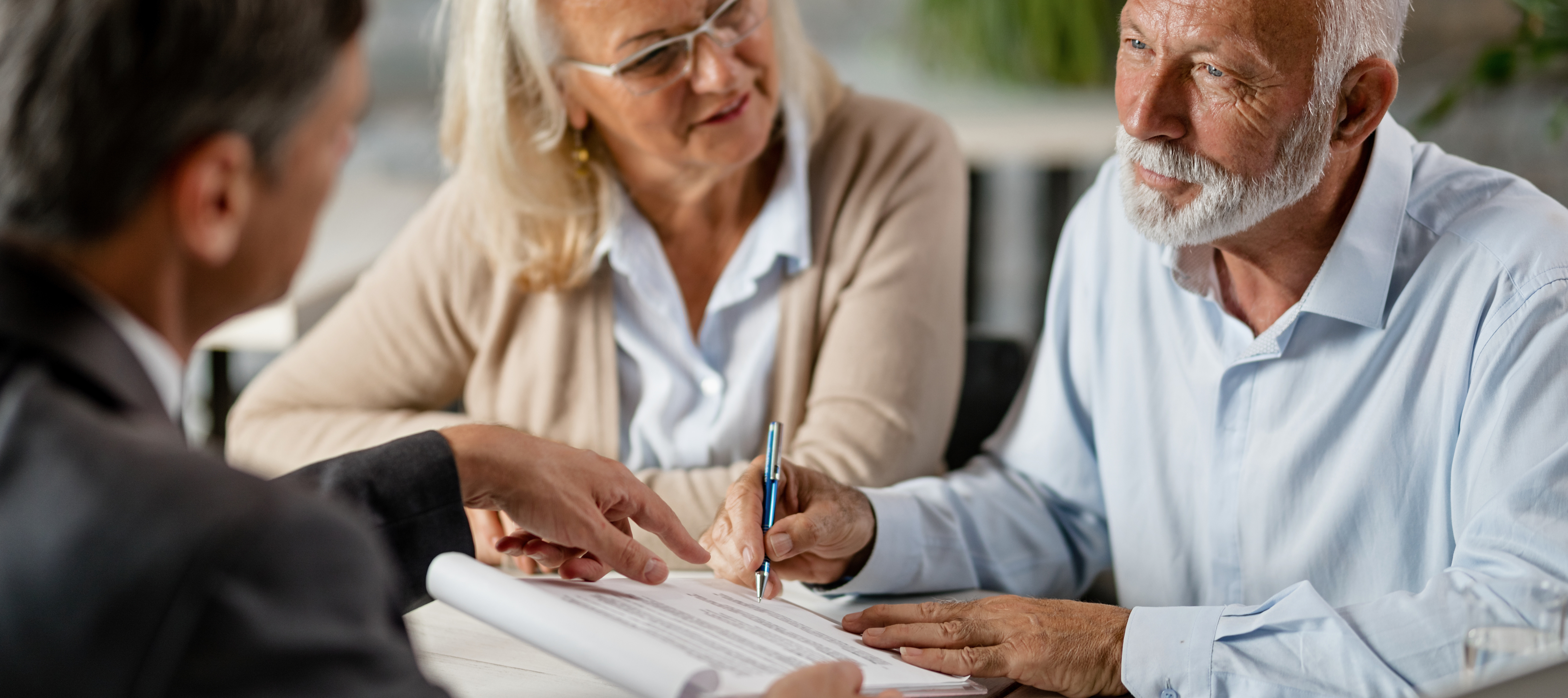 An older American couple sits down with a tax professional.