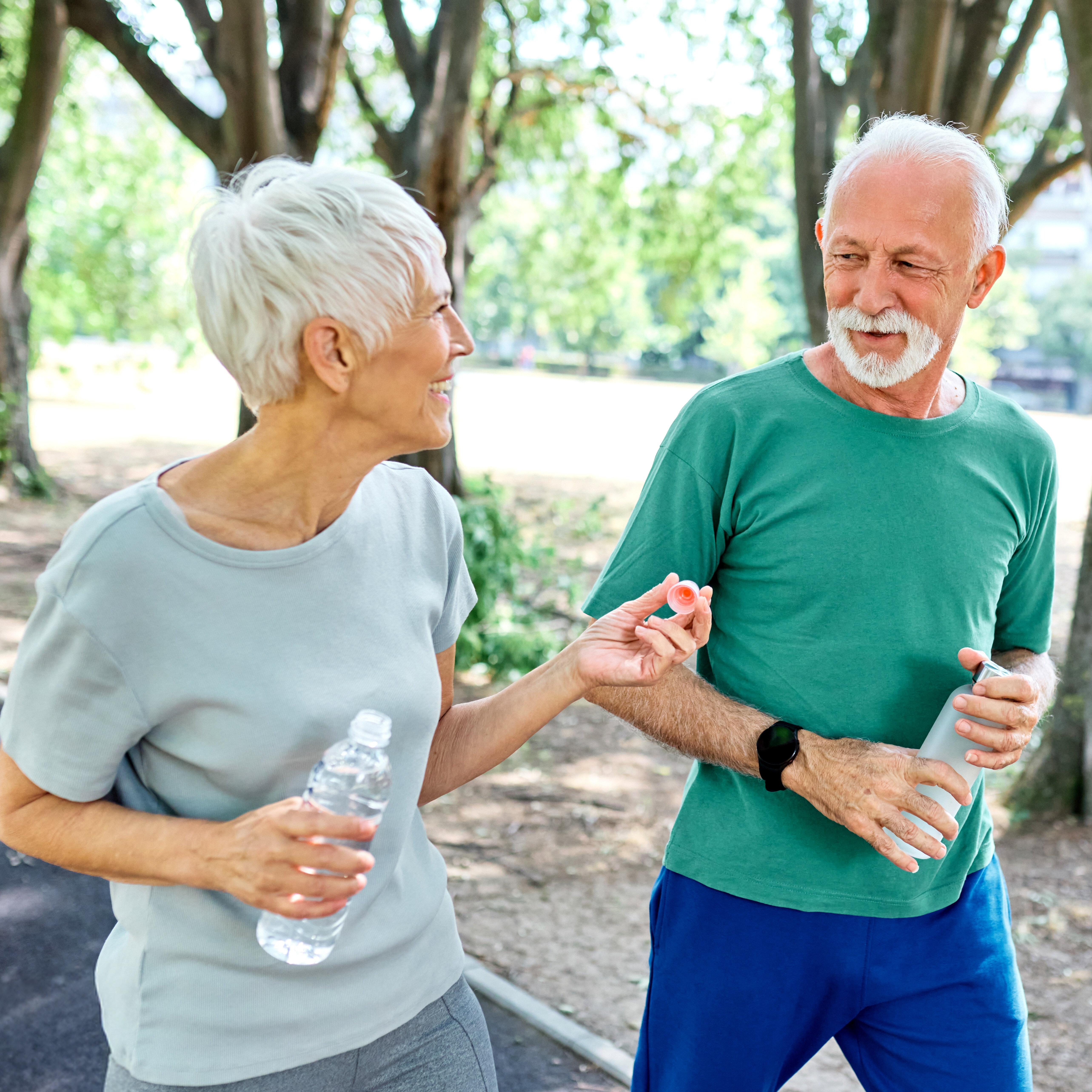 A couple enjoys a walk on a sunny day.