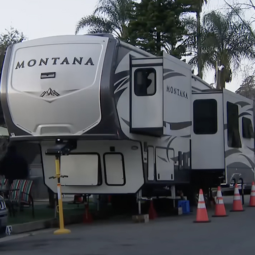A California family living in an RV after the wildfires claimed their home was ticketed, adding to their woes.