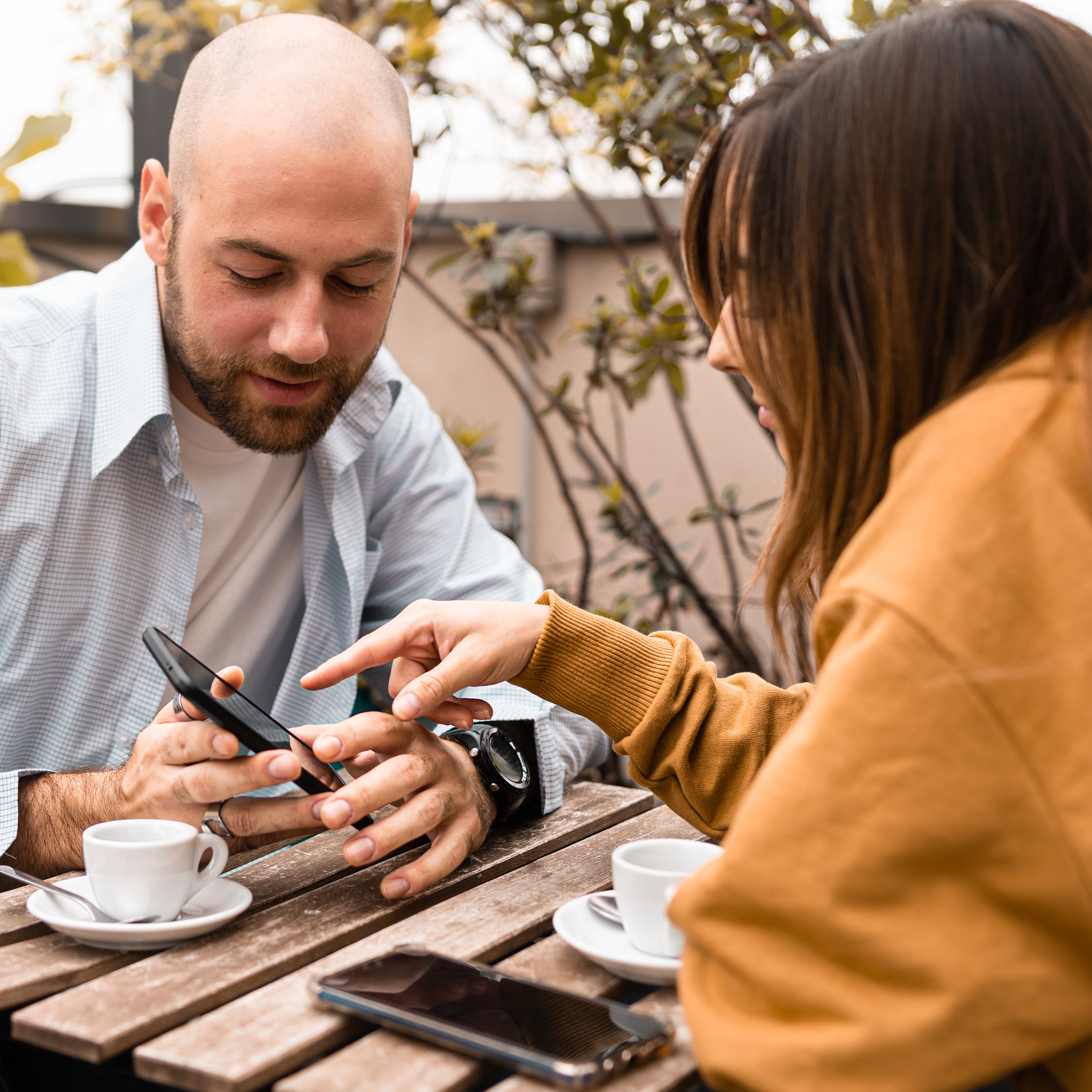 A couple, looking at a smartphone, could be one of many Americans who feel uncomfortable with their financial security in 2026.