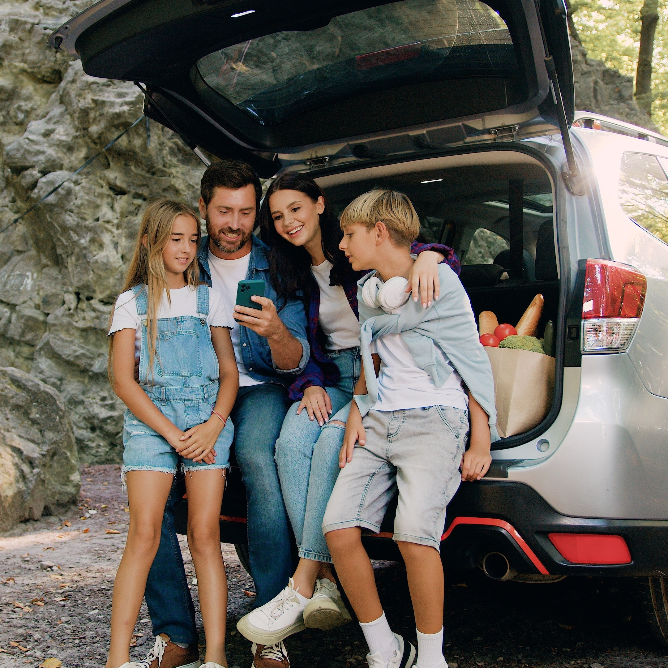 A family enjoys each other's company during a camping trip.