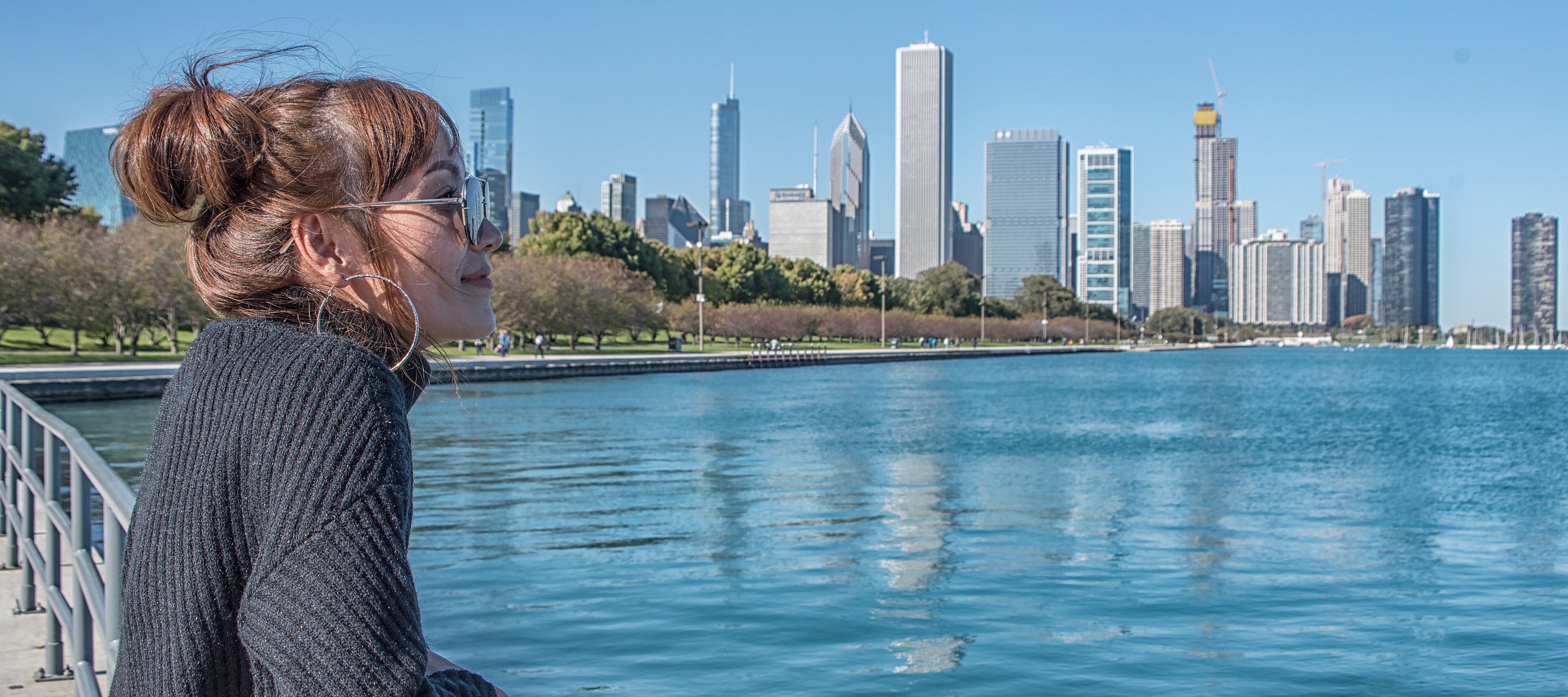 A woman walking in Lincoln Park near Chicago, recently ranked the U.S. city with the most people in financial distress.