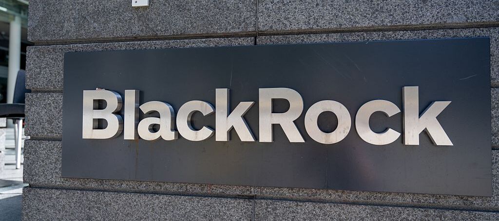 Exterior sign for BlackRock investment firm outside office building, San Francisco, California.