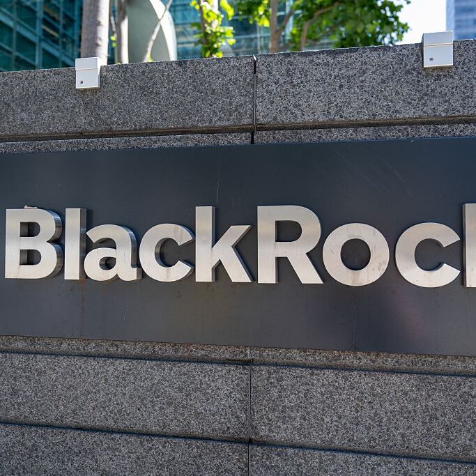 Exterior sign for BlackRock investment firm outside office building, San Francisco, California.