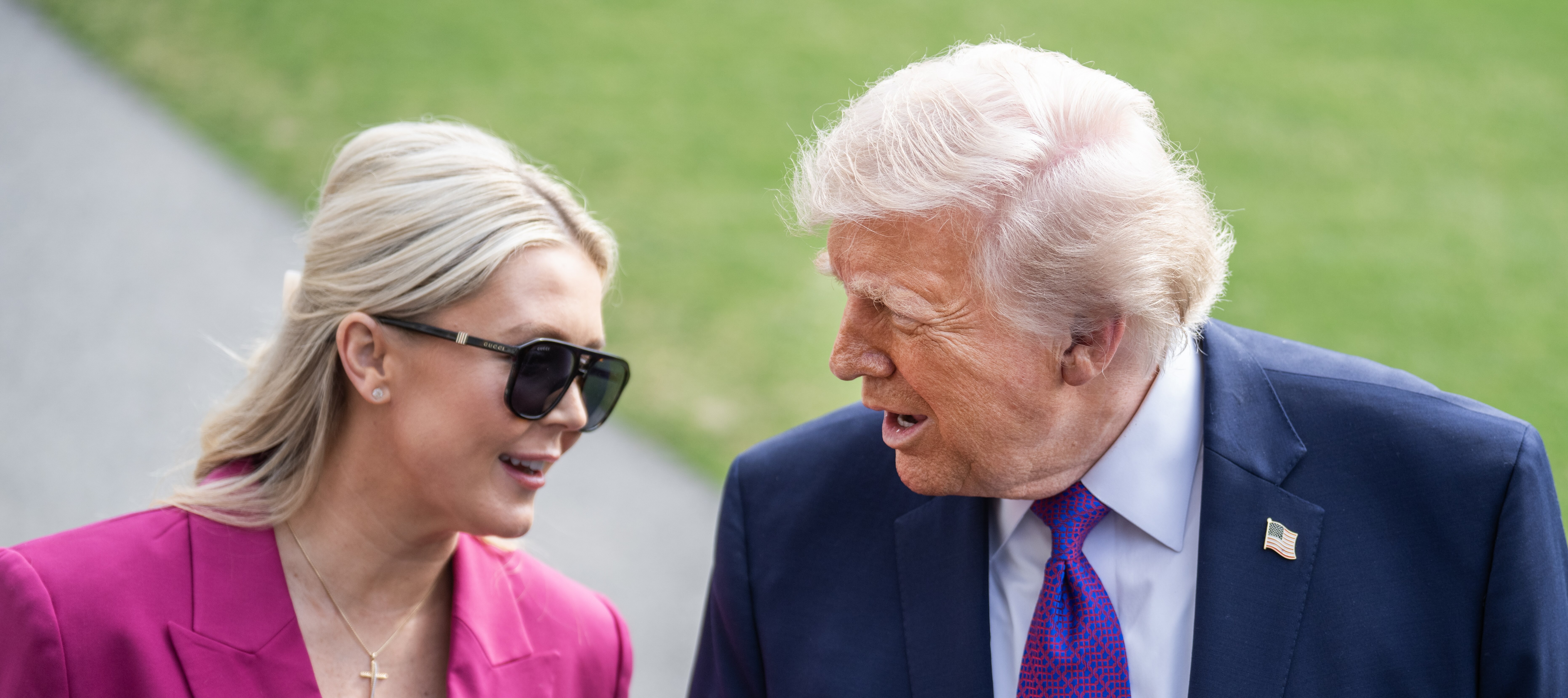 Karoline Leavitt, White House press secretary, and President Donald Trump speak with reporters on the South Lawn of the White House before boarding Marine One.