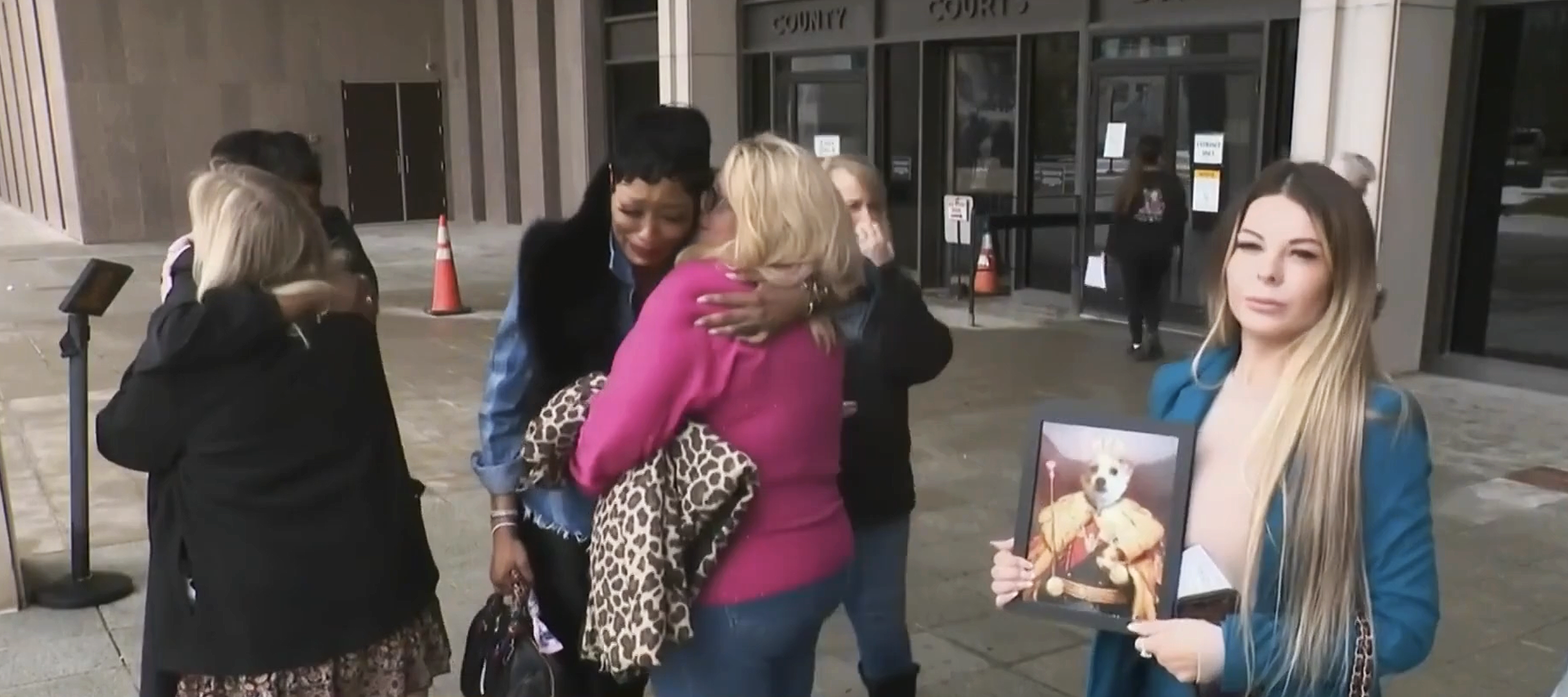 Pet owners comfort one another outside a courthouse in Maryland.