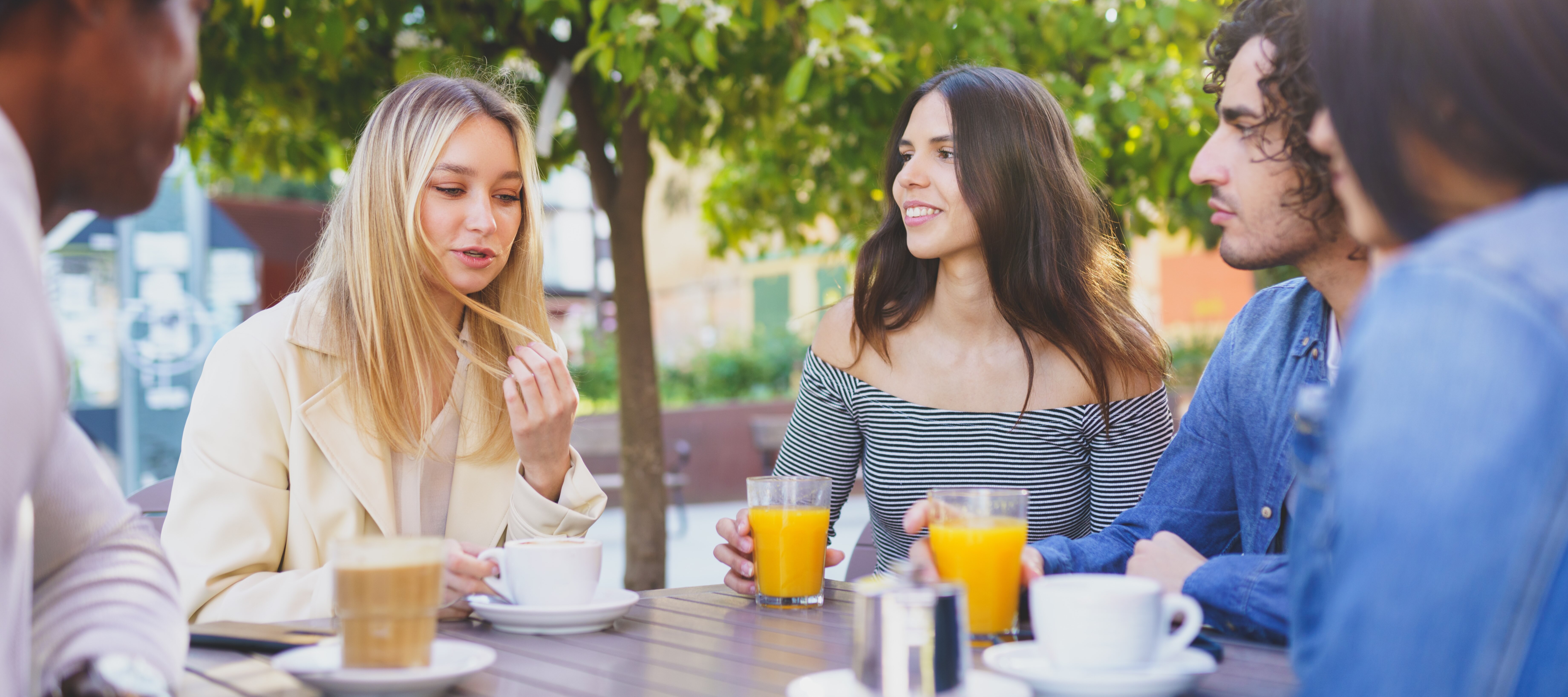 Group of young people discussing their salaries.