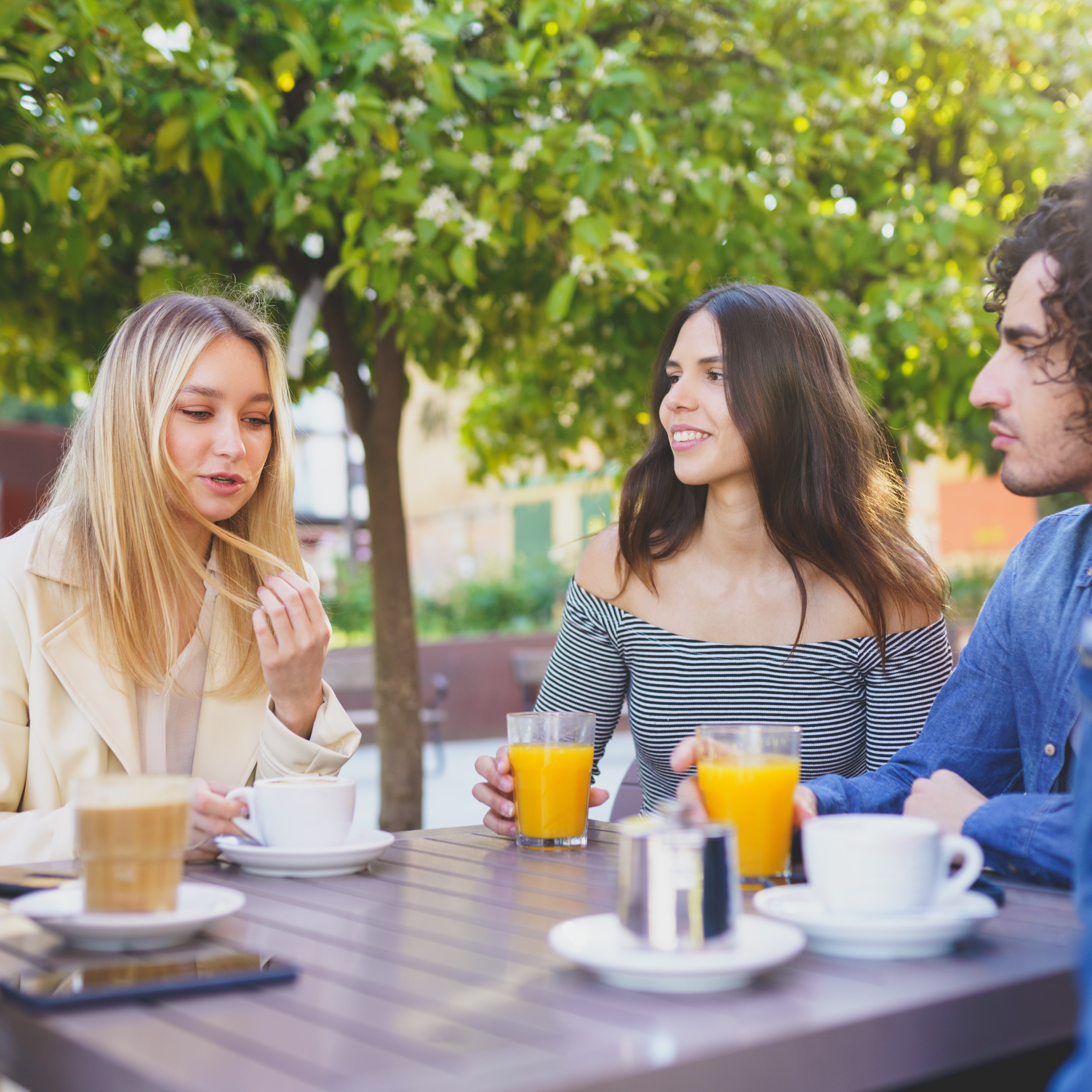 Group of young people discussing their salaries.
