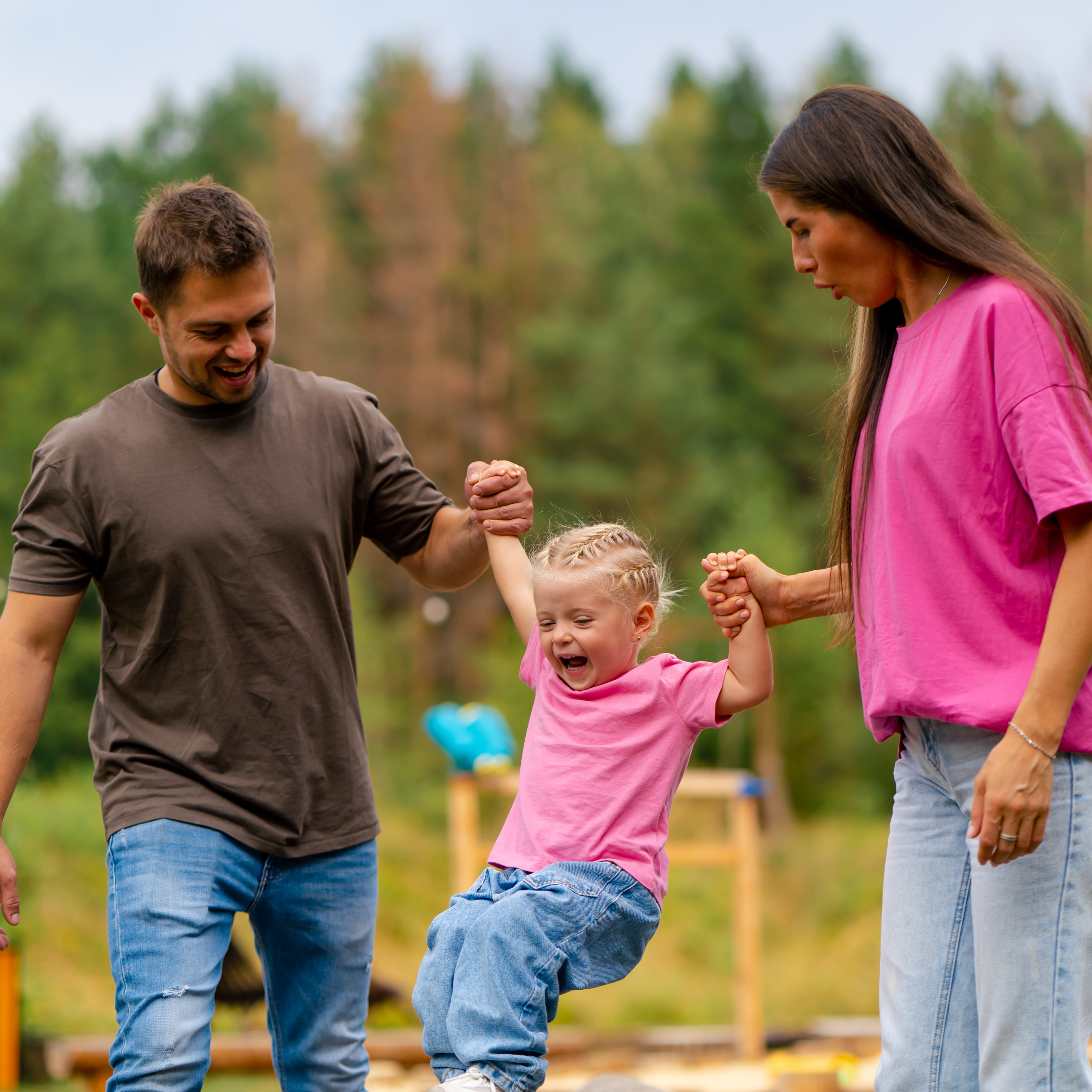 A young family enjoys a day at the park.
