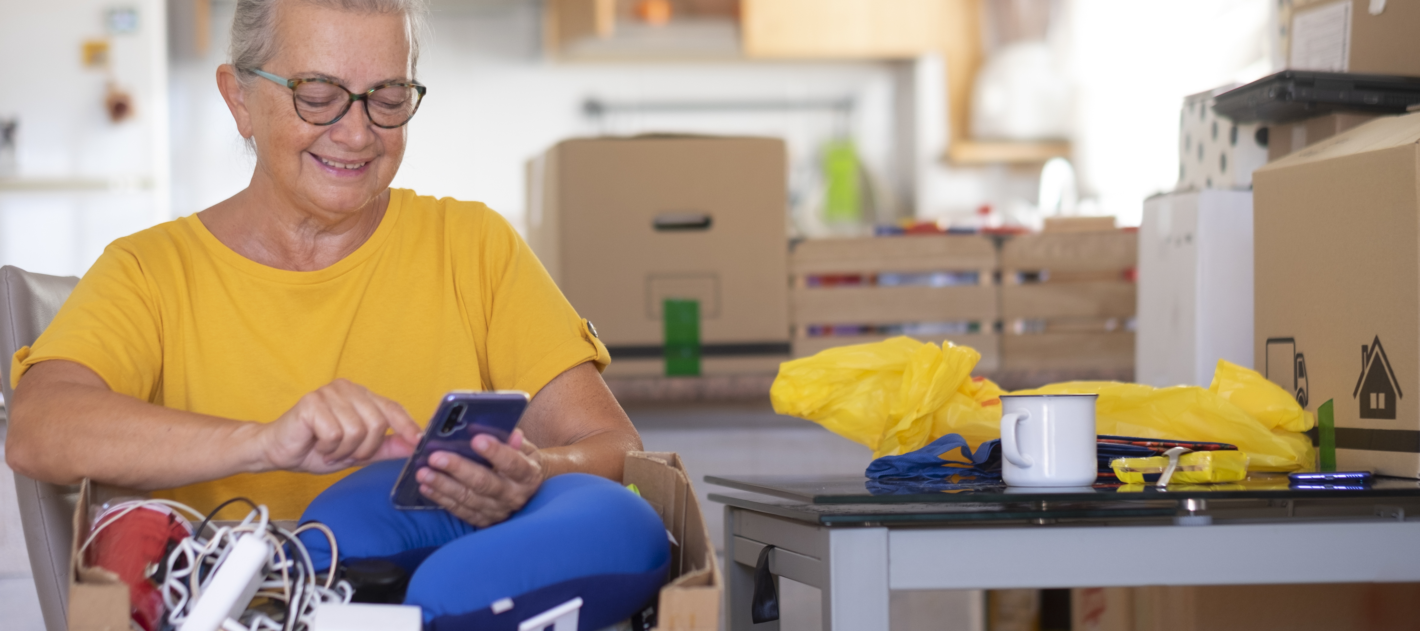 A woman packs her things as she gets ready for a move.