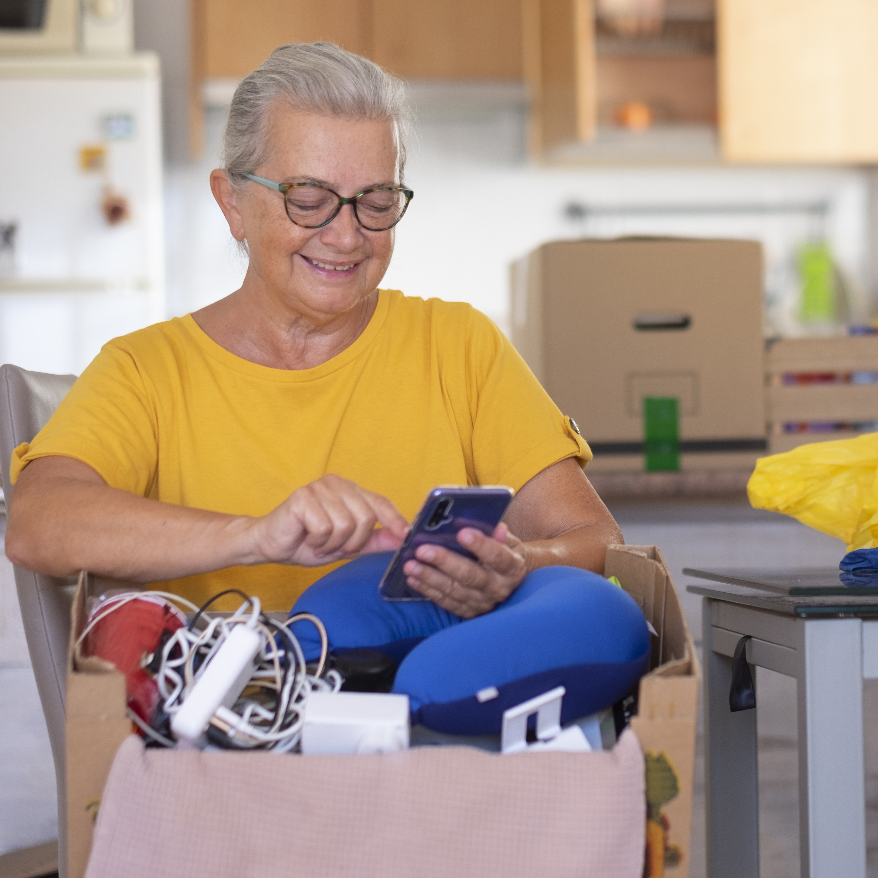 A woman packs her things as she gets ready for a move.