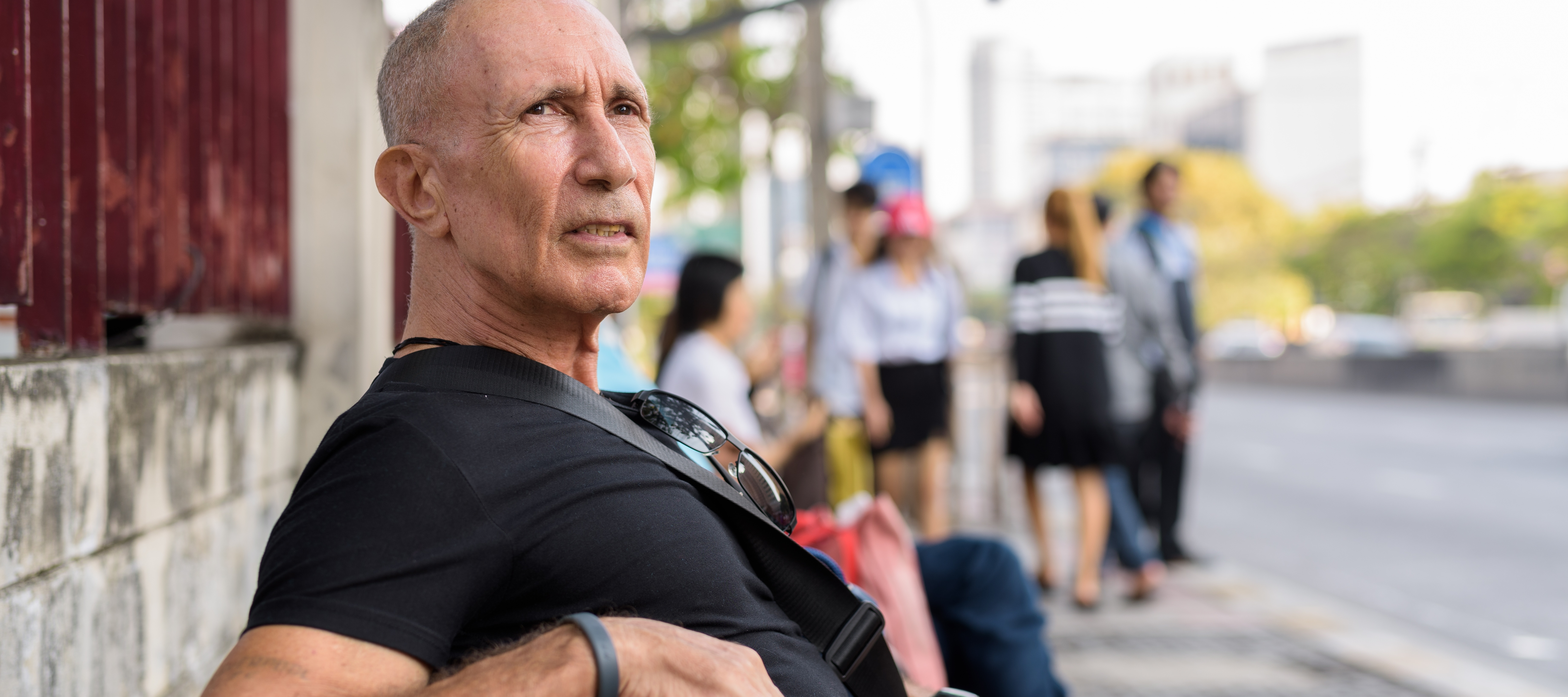 A man waiting at a bus stop could be one of many Gen Xers who worry they are behind on their retirement savings.