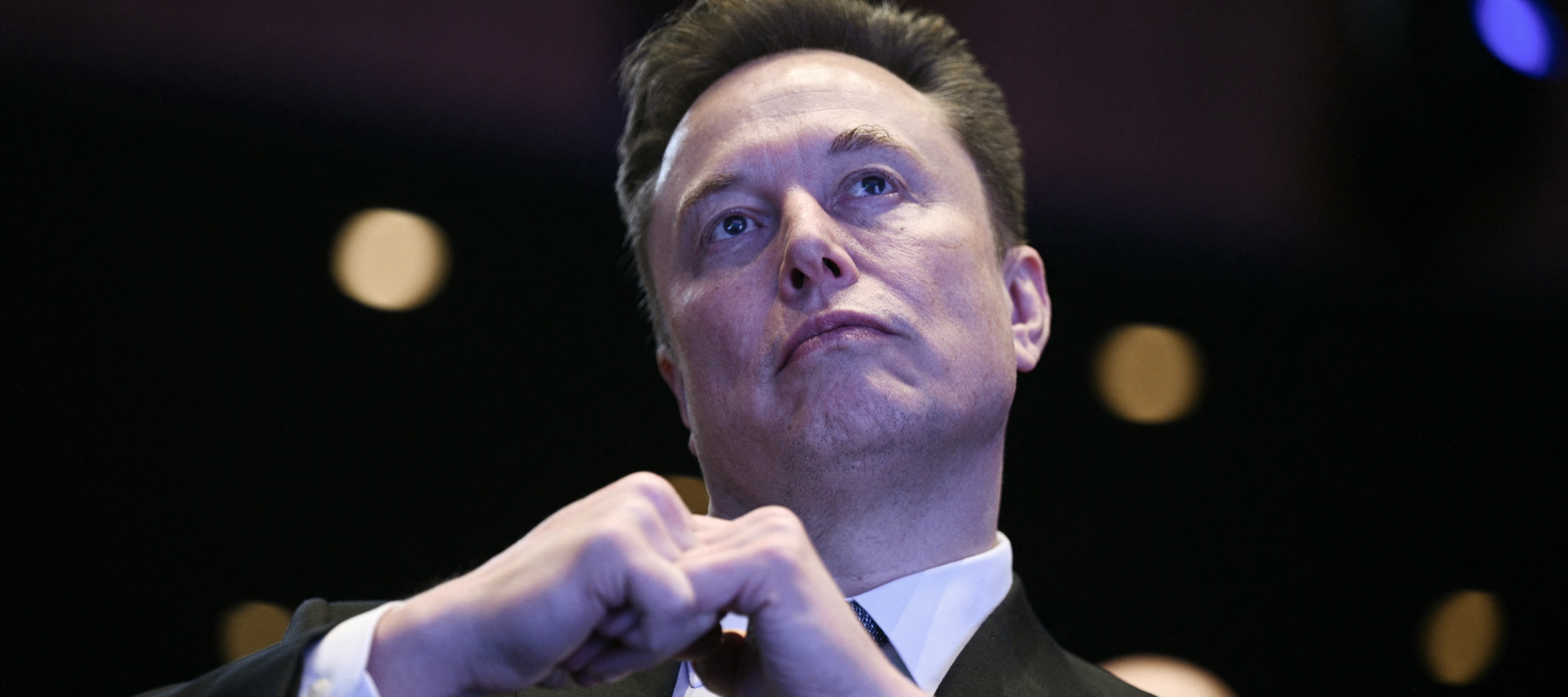 Elon Musk looks on as US President Donald Trump speaks at the US-Saudi Investment Forum in Washington, DC on November 19, 2025.