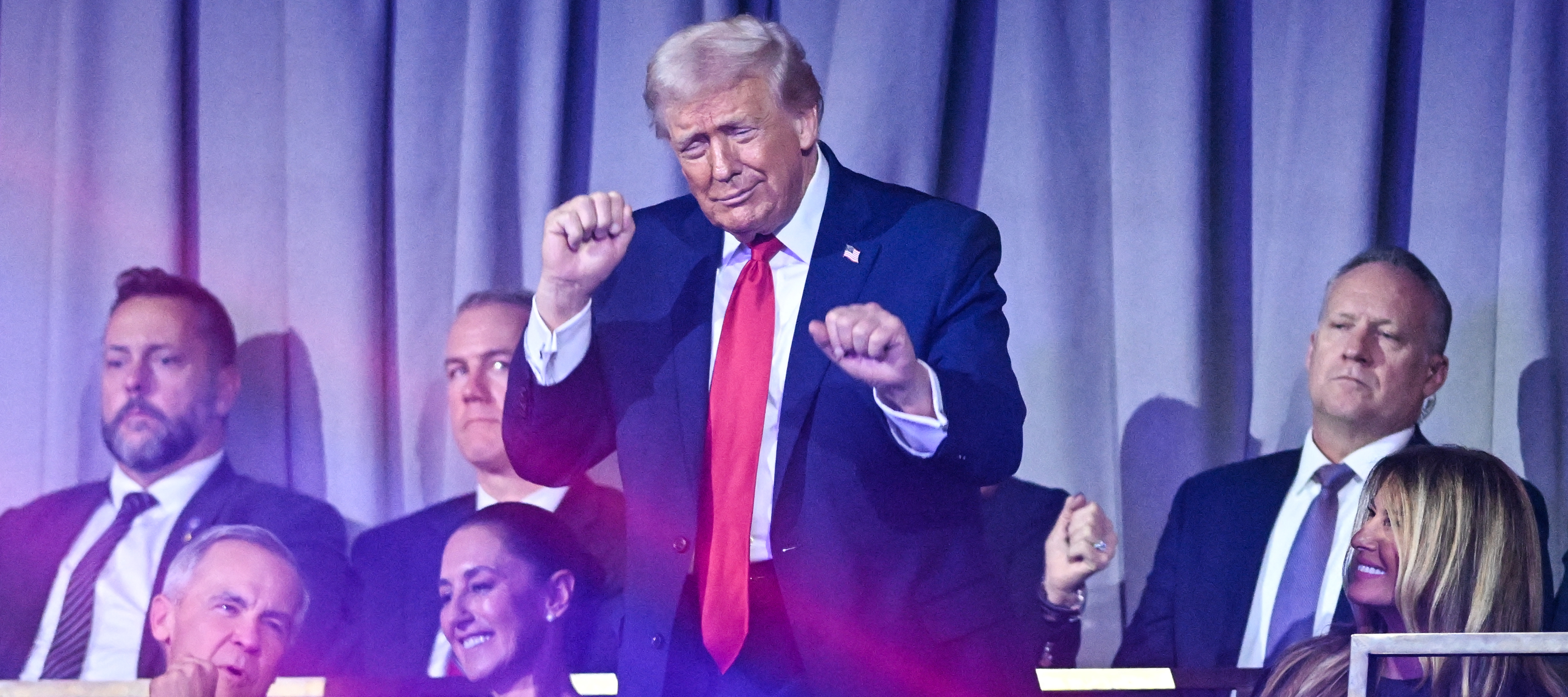 US President Donald Trump dances after the results of the draw for the 2026 FIFA Football World Cup taking place in the US, Canada and Mexico.