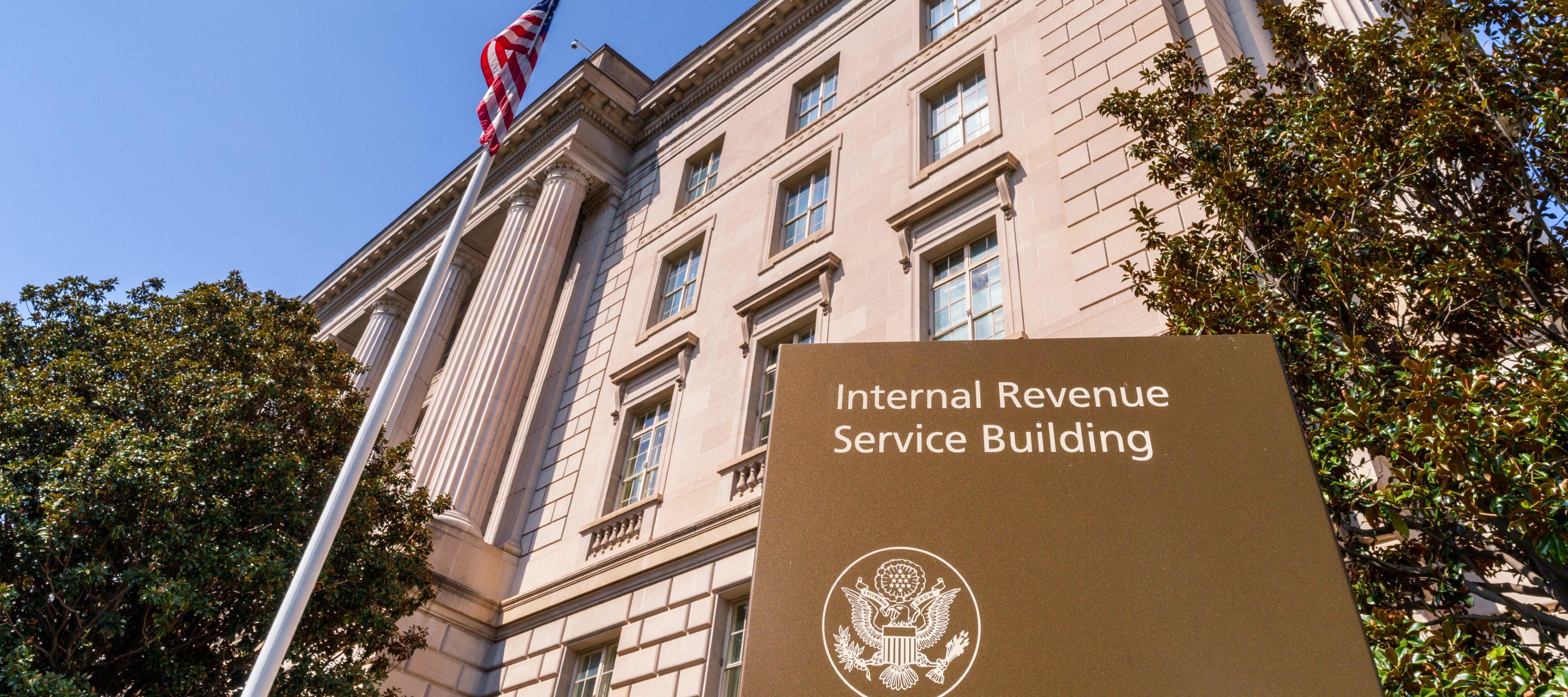 A sign marks the front of the U.S. Internal Revenue Service (IRS) headquarters building in Washington, DC.