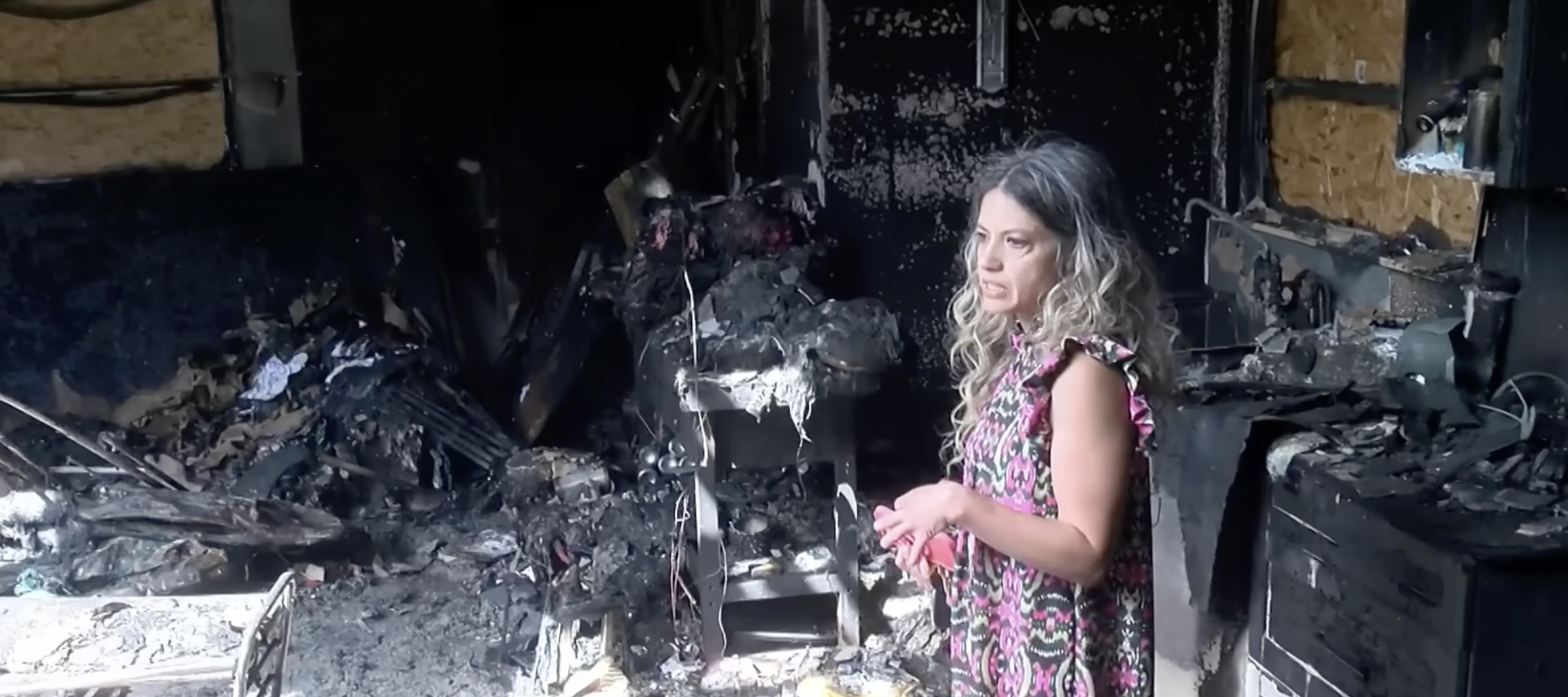 Florida woman shows news anchor her burnt down home.