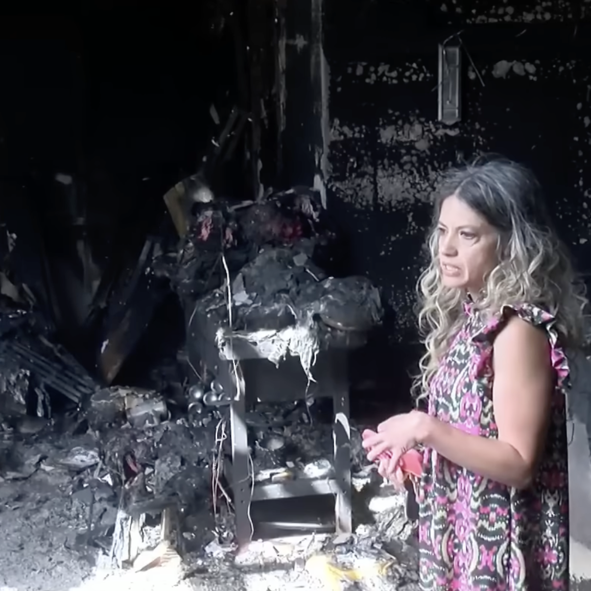 Florida woman shows news anchor her burnt down home.