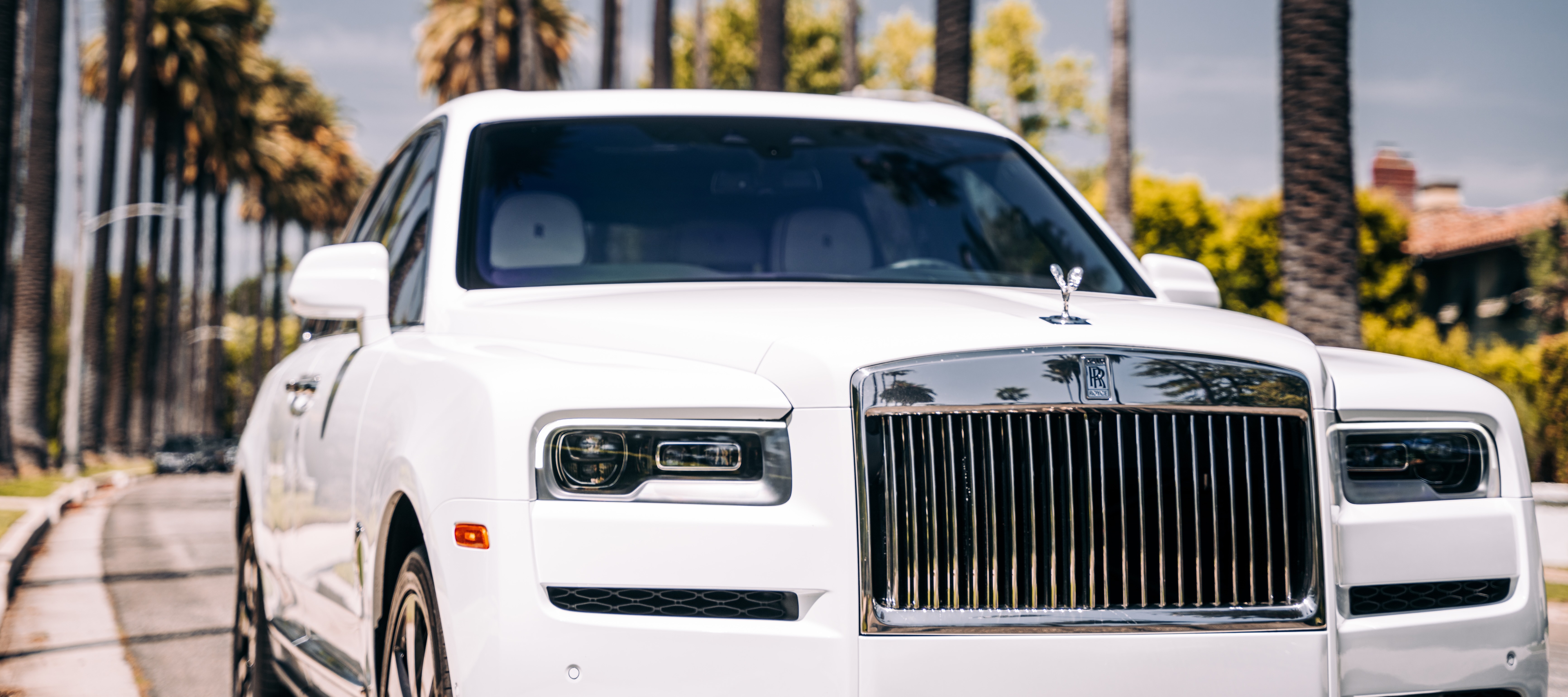 A Florida car dealer has been sentenced to prison for wire fraud and attempting to ship stolen cars overseas.