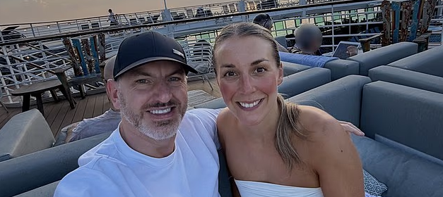 Katrina and Kevin Middleton pose for a selfie on the top deck the Allure of the Seas, the Royal Caribbean cruise ship that they live on.