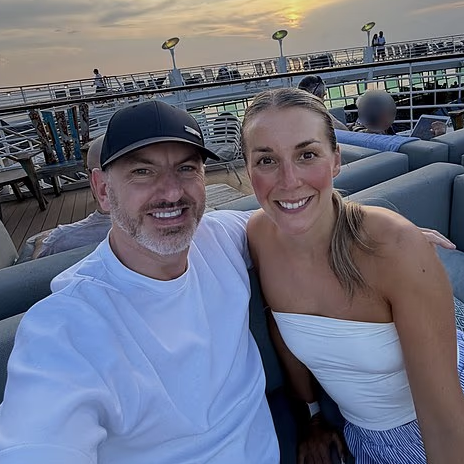 Katrina and Kevin Middleton pose for a selfie on the top deck the Allure of the Seas, the Royal Caribbean cruise ship that they live on.