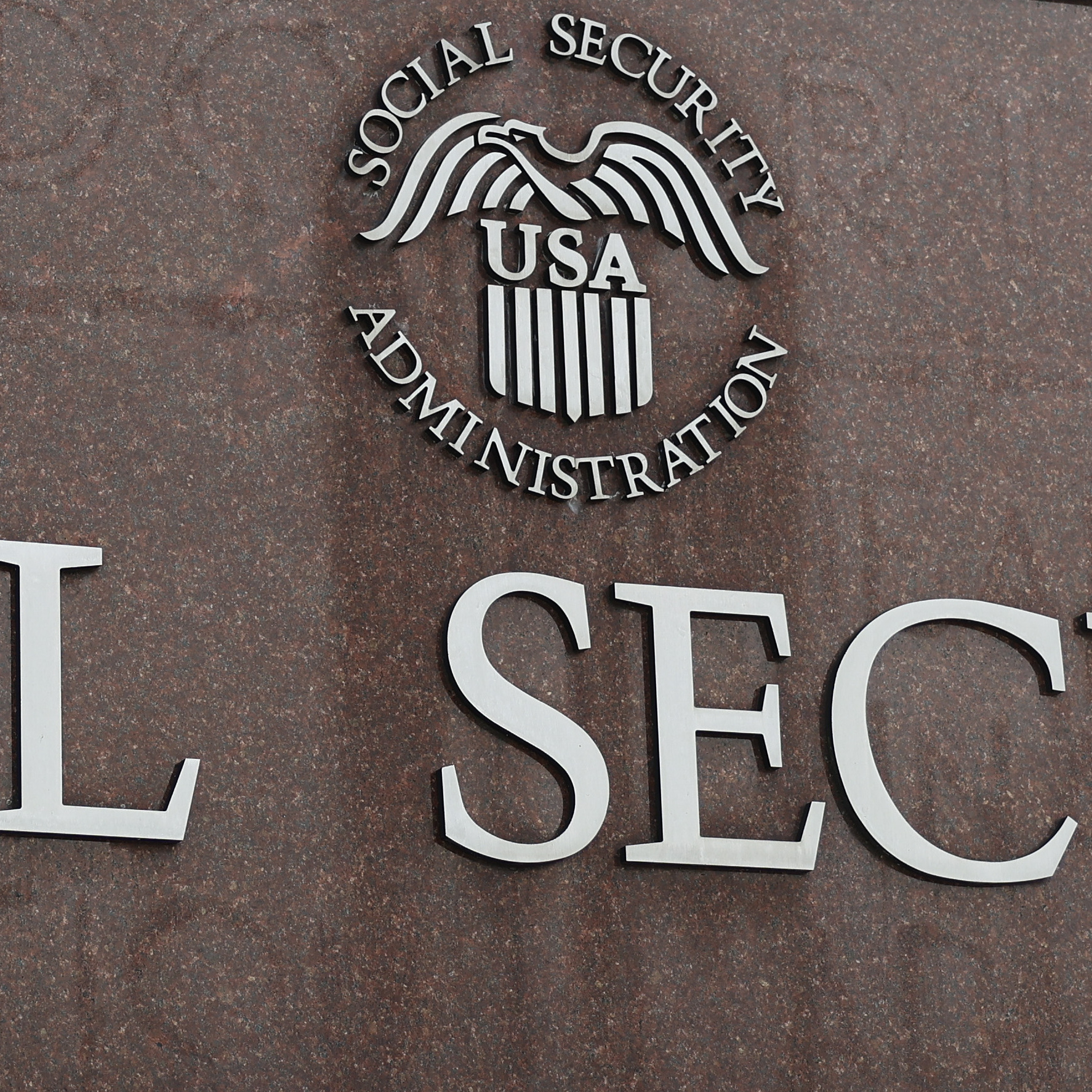 A sign in front of the entrance of the Security Administration's main campus on a gloomy March day.