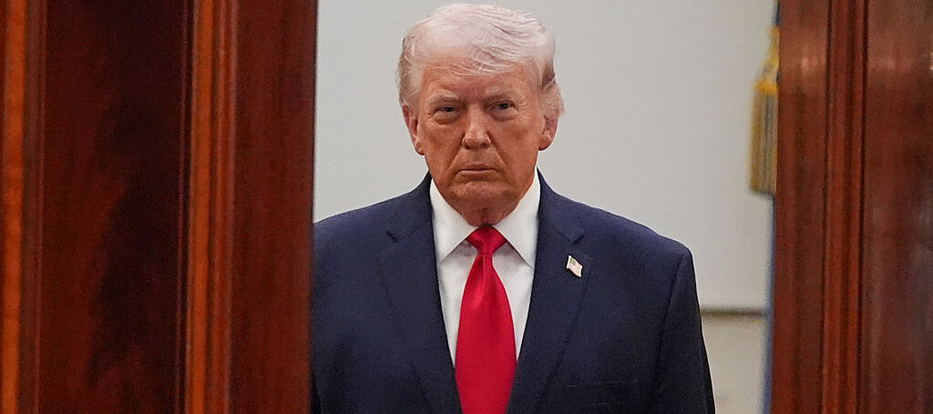 U.S. President Donald Trump arrives to speak in the Cross Hall of the White House on April 1, 2026