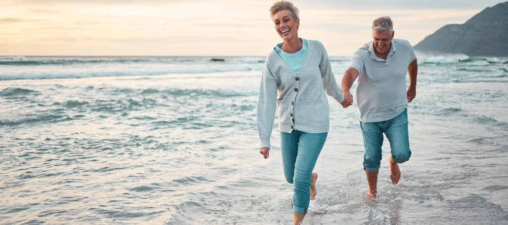 Couple frolicking on the beach