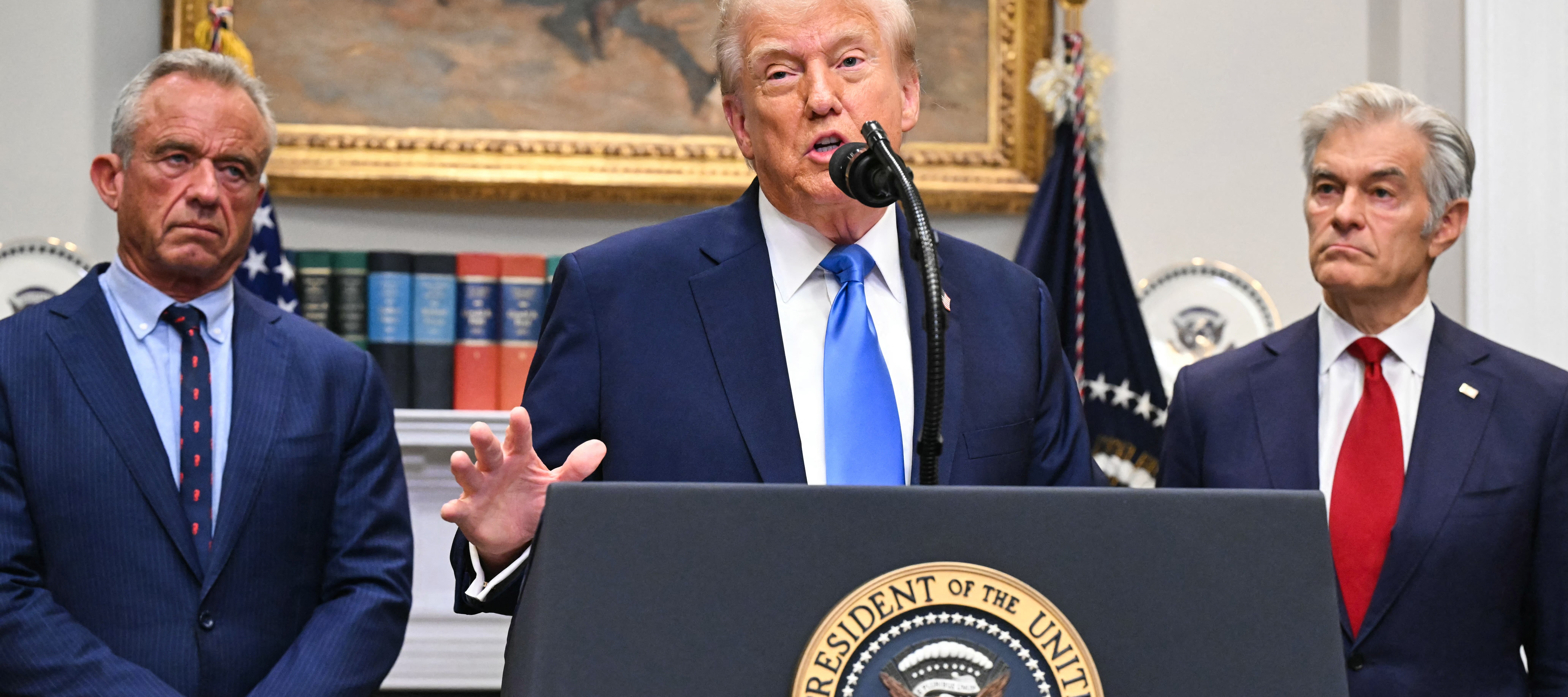 US President Donald Trump, alongside Secretary of Health and Human Services Robert F. Kennedy Jr. and Medicare and Medicaid Administrator Mehmet Oz