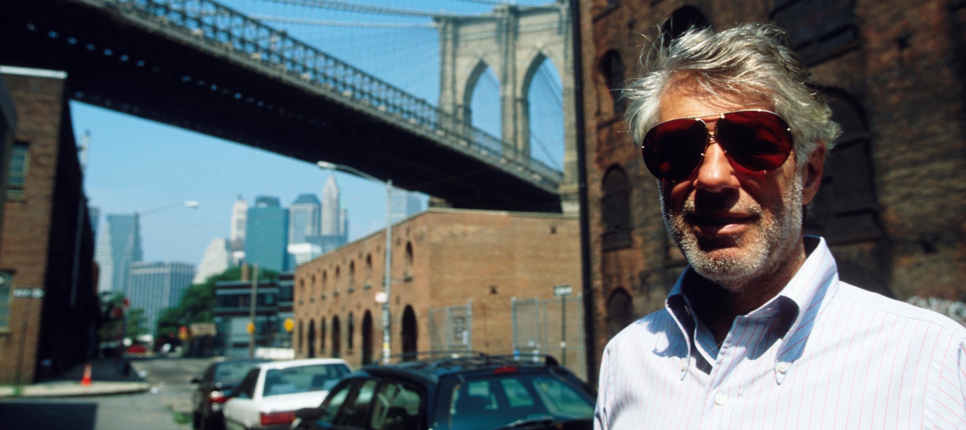 David Walentas stands near the iconic Brooklyn Bridge.