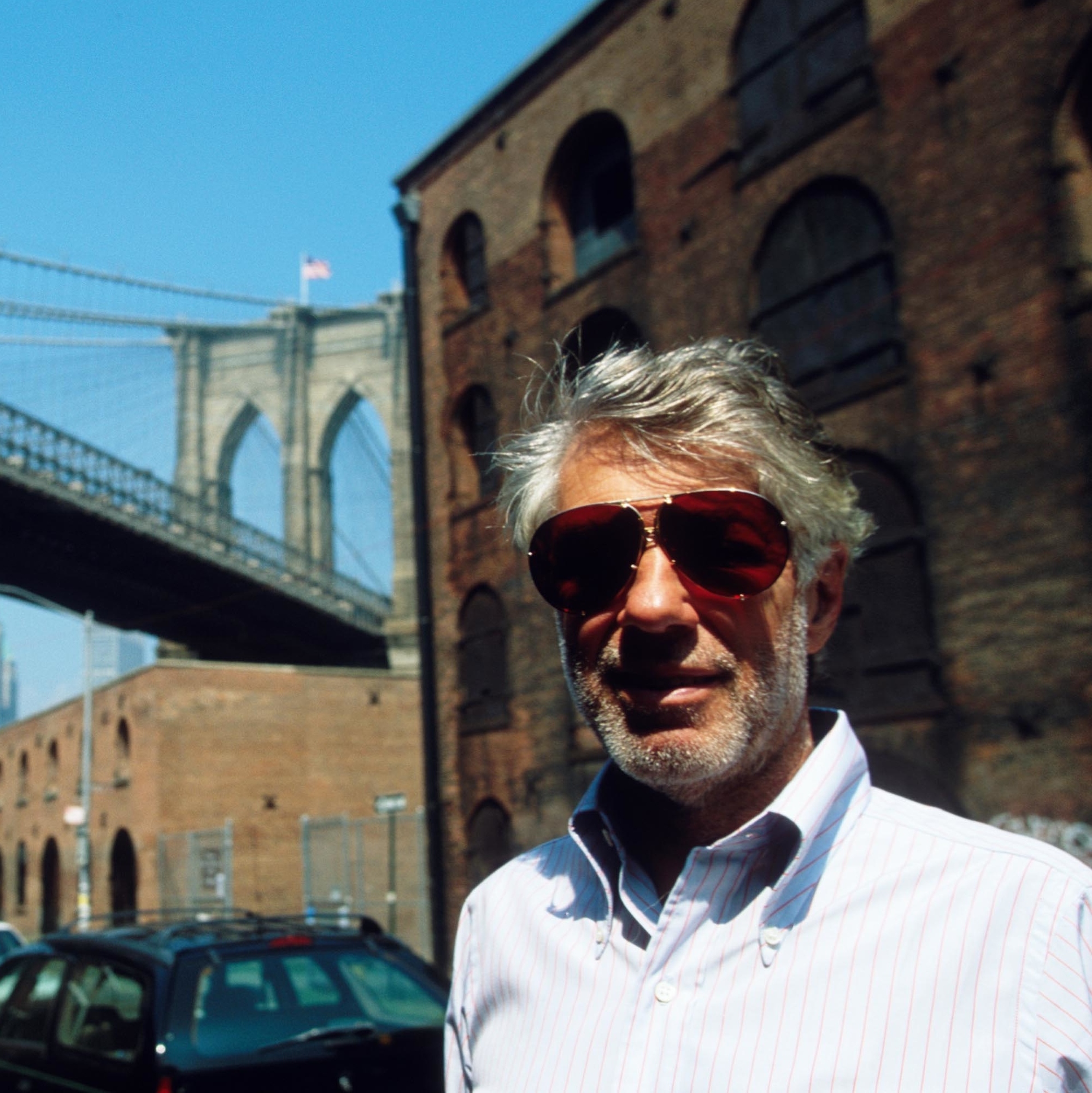 David Walentas stands near the iconic Brooklyn Bridge.