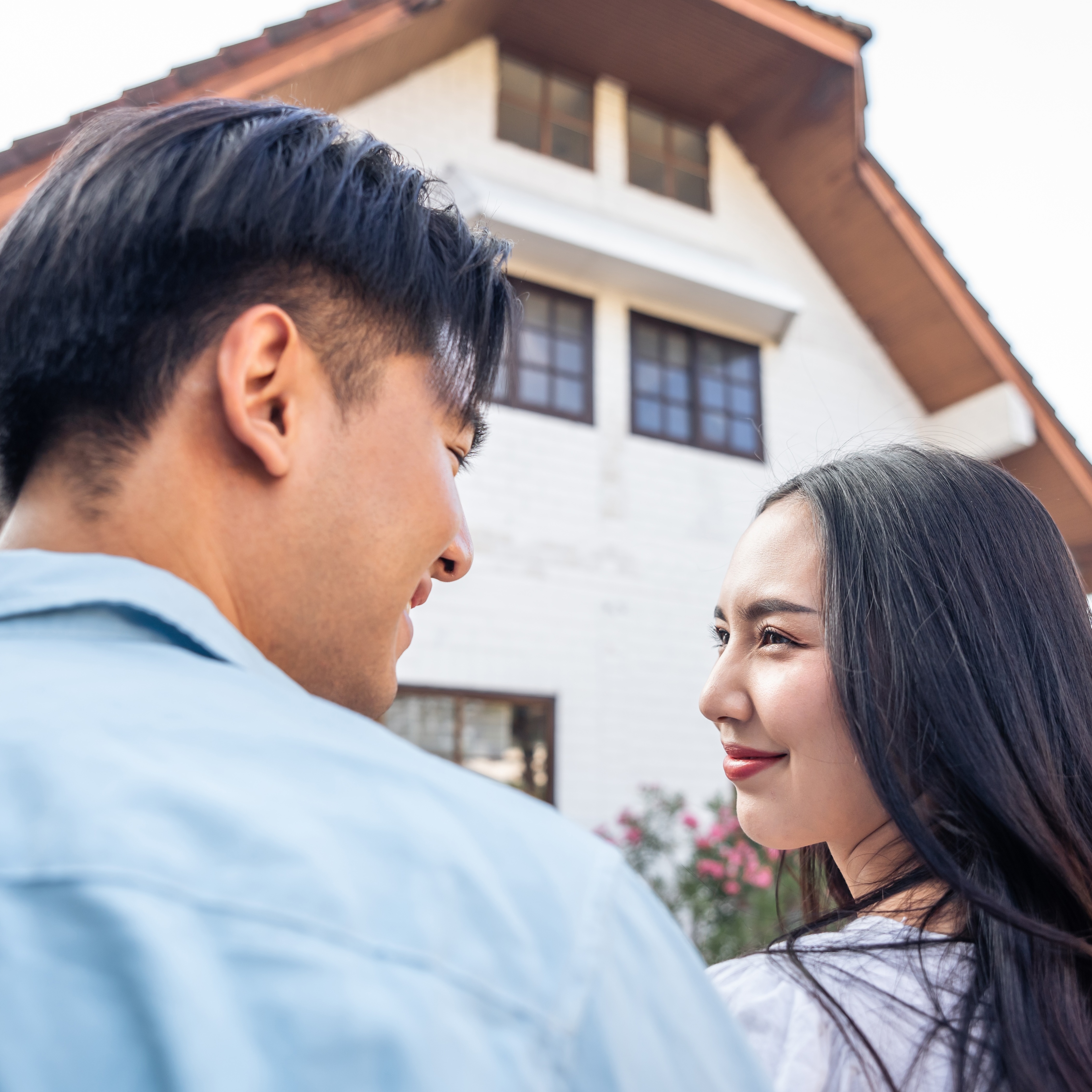 A young couple, seen here looking at a house, could use fractional ownership to break into the housing market sooner.