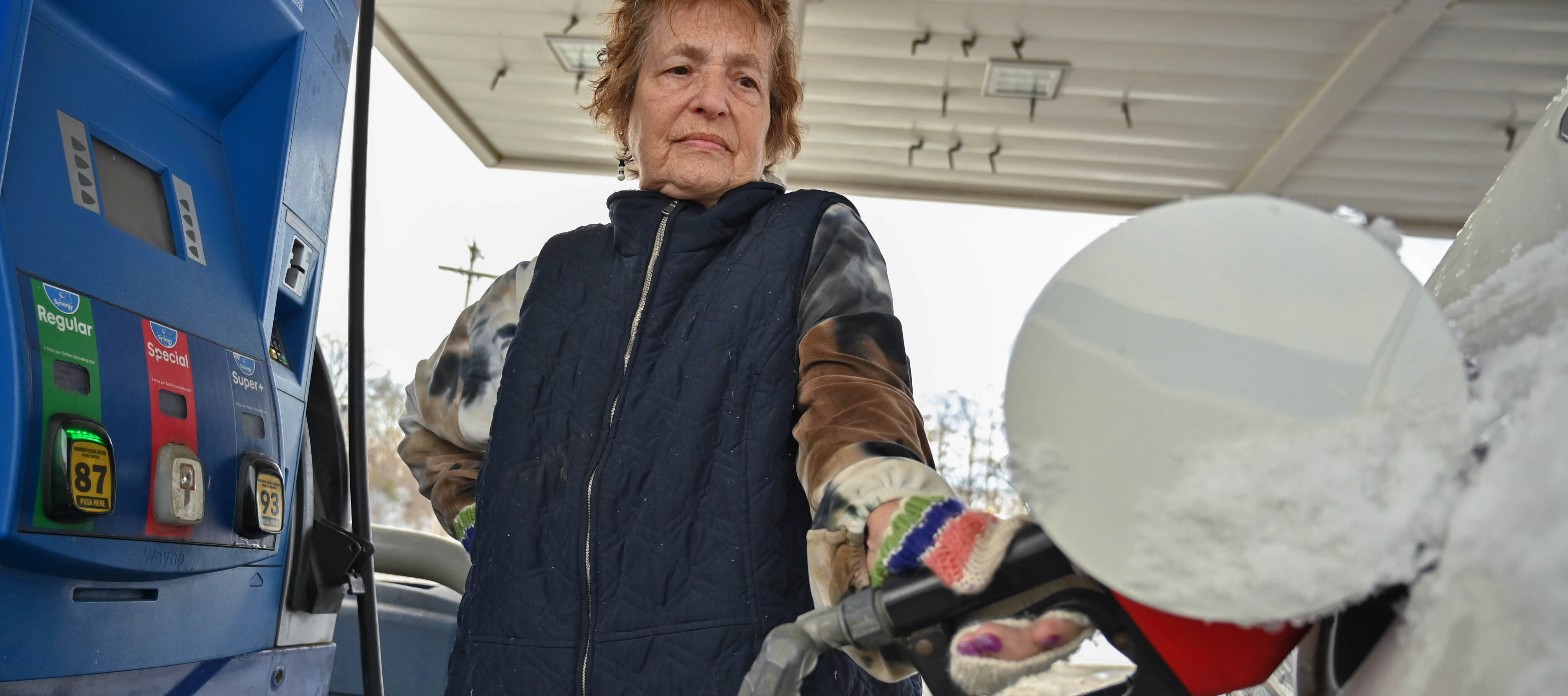 As a woman fills up her car, gas prices have increased more than 50% since last year.