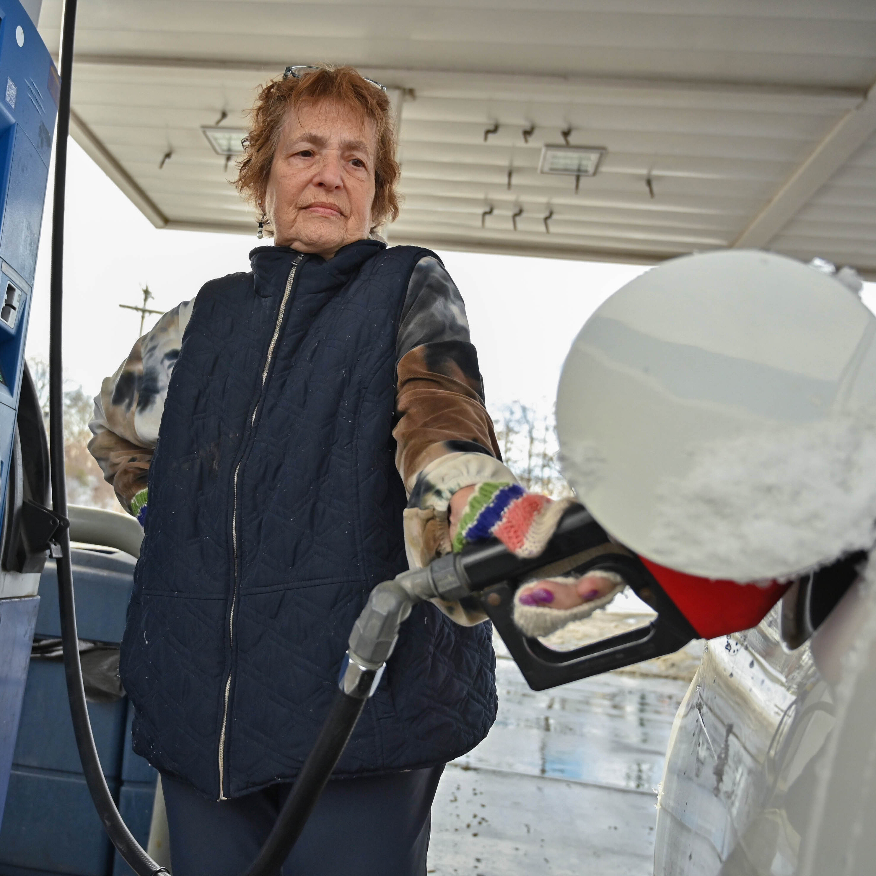 As a woman fills up her car, gas prices have increased more than 50% since last year.
