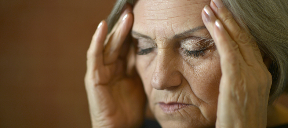 A photo of a stressed elderly woman