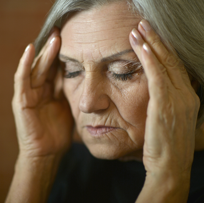 A photo of a stressed elderly woman