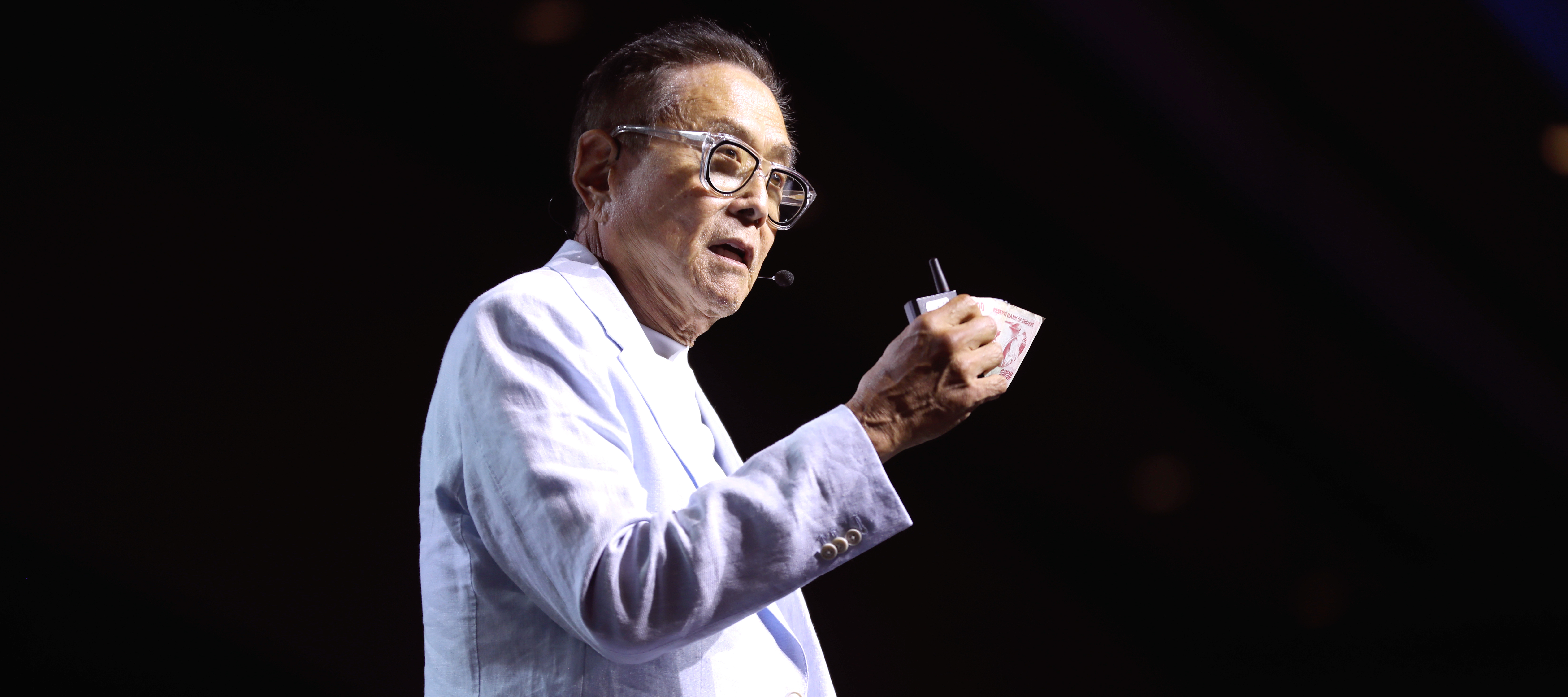 Robert Kiyosaki speaking with attendees at the 2024 FreedomFest at Caesars Forum Conference Center in Las Vegas, Nevada.