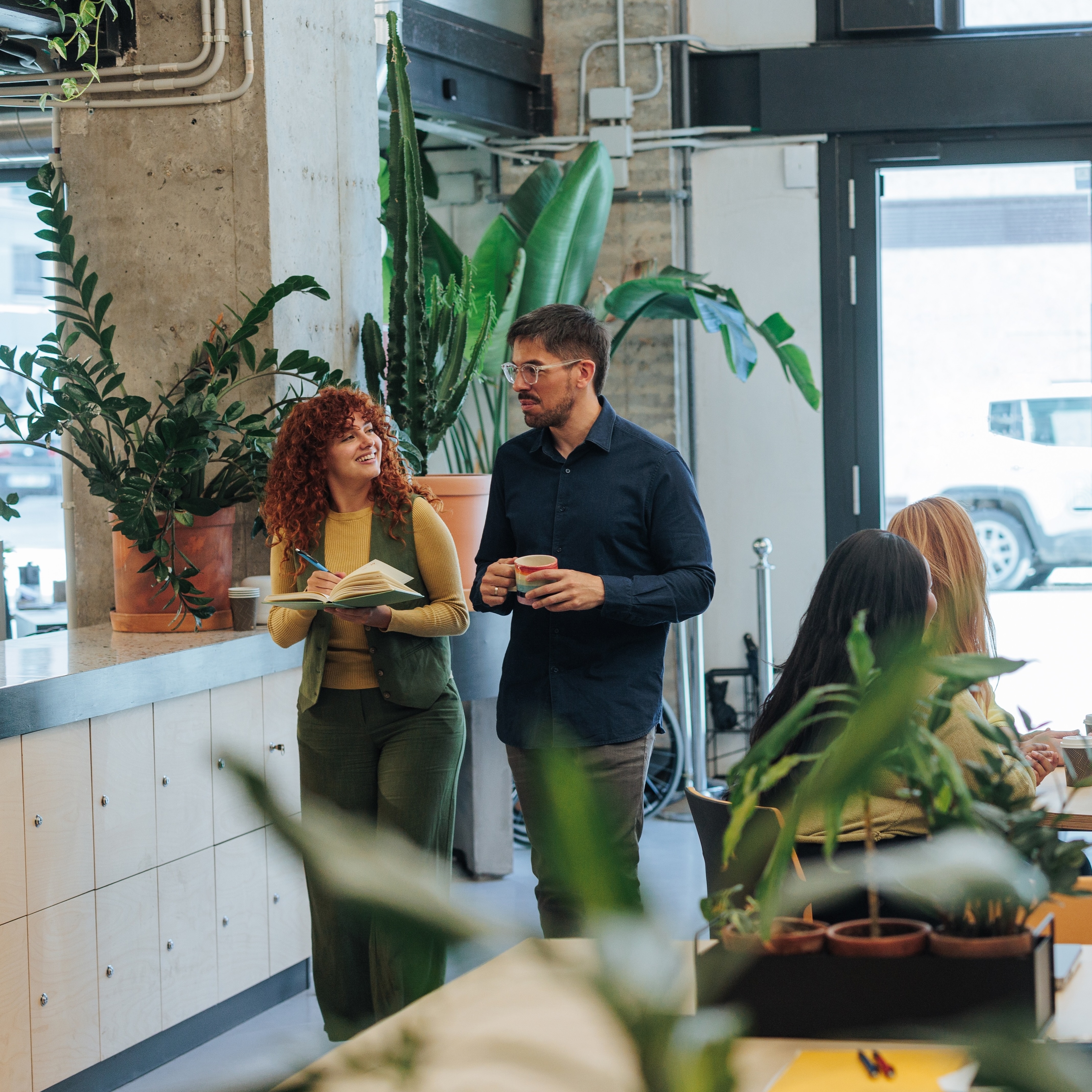 Business professionals collaborating and discussing ideas