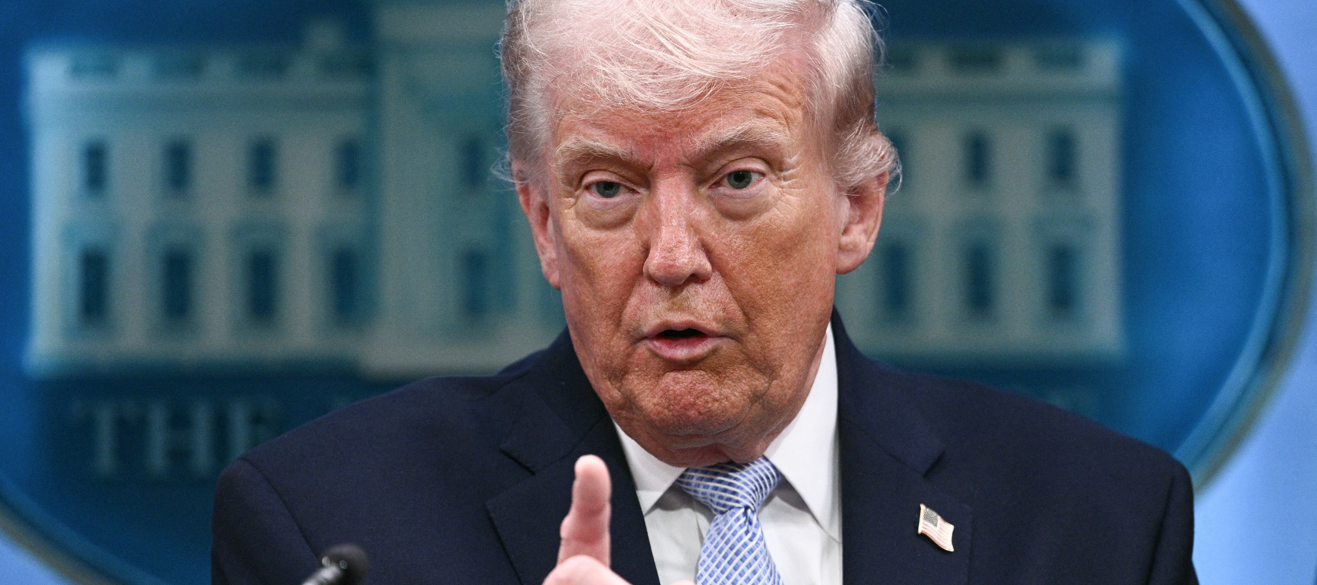 Trump wagging his finger at a podium