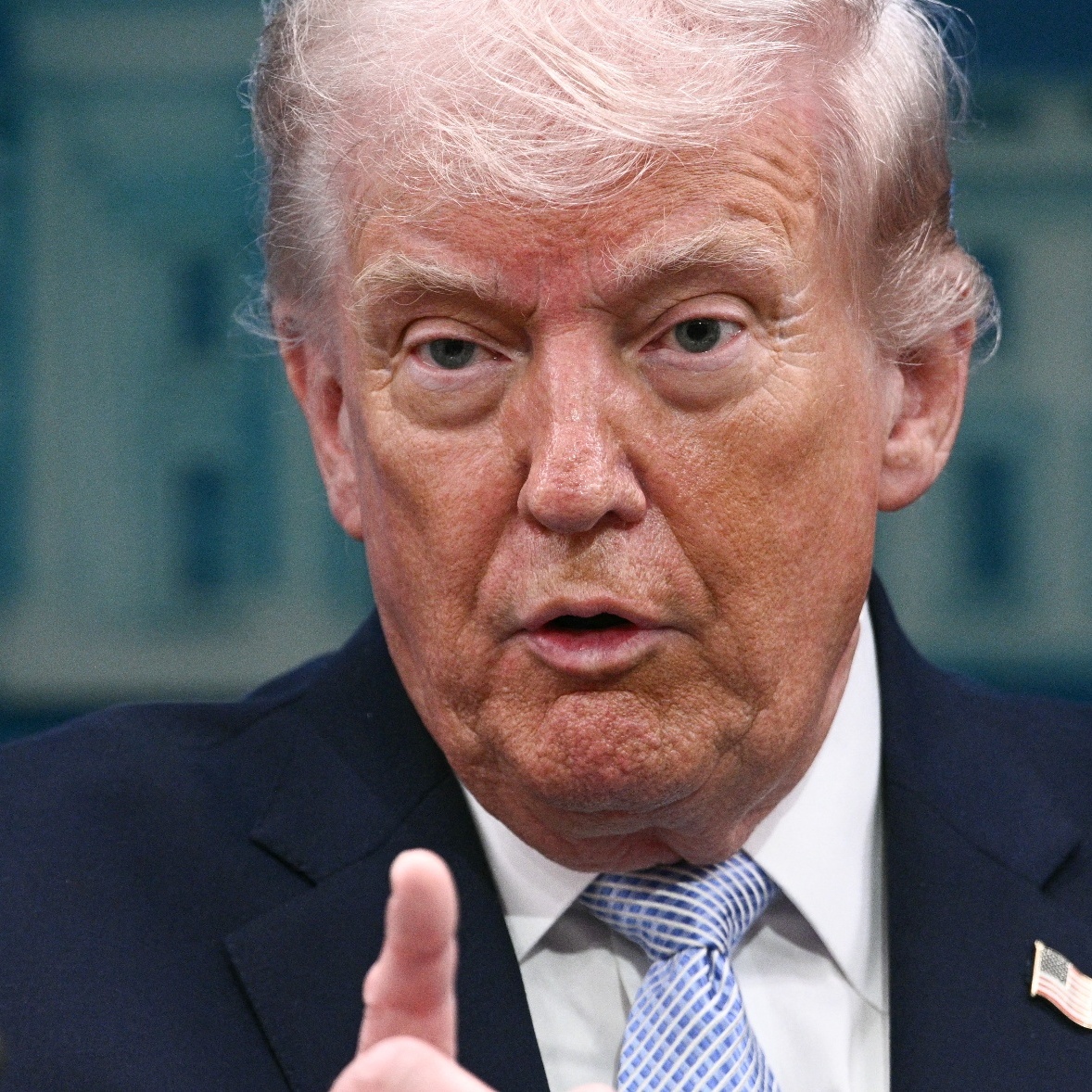 Trump wagging his finger at a podium