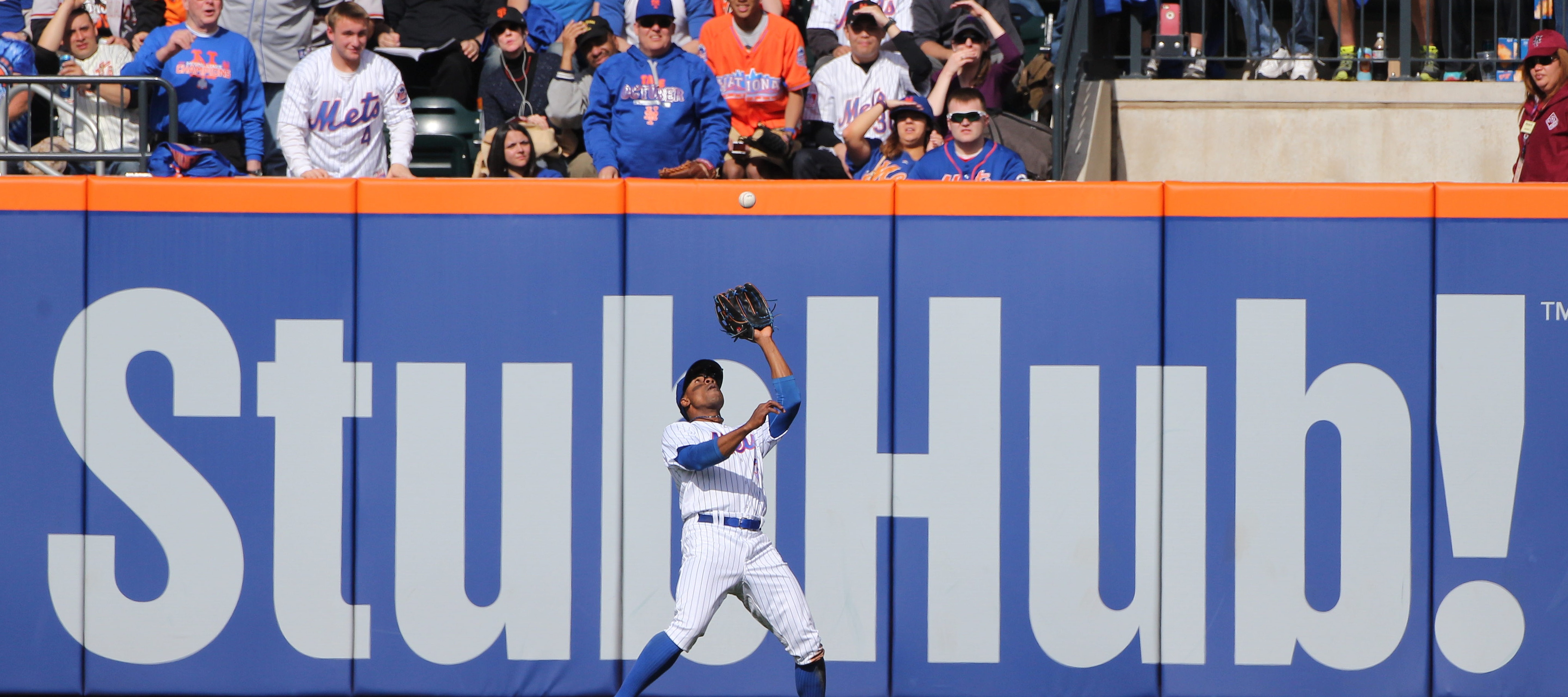 Ticket reseller StubHub, its logo seen here on the outfield fence at a New York Mets game, will pay $10 million in refunds after a settlement over "deceptive" pricing.