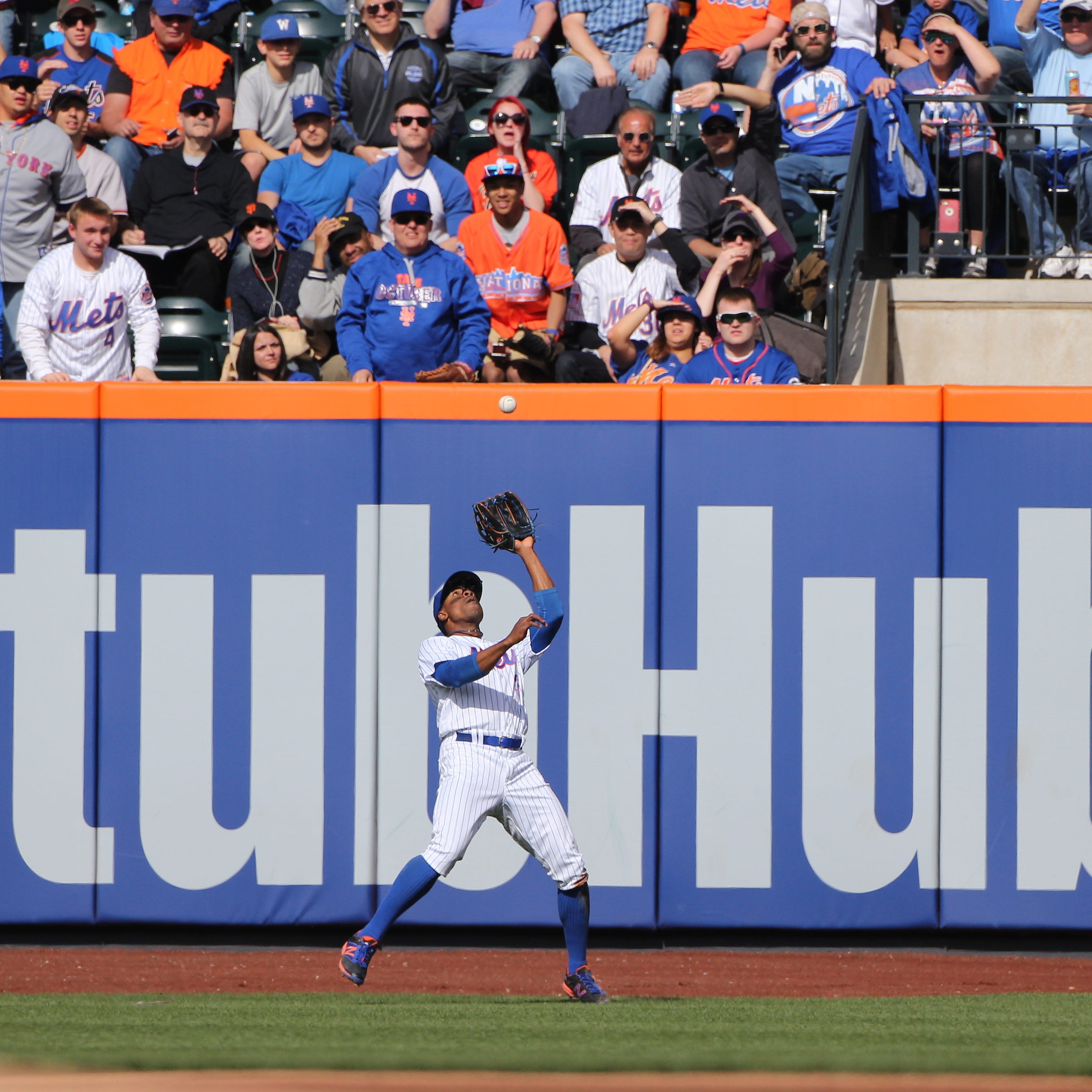 Ticket reseller StubHub, its logo seen here on the outfield fence at a New York Mets game, will pay $10 million in refunds after a settlement over "deceptive" pricing.