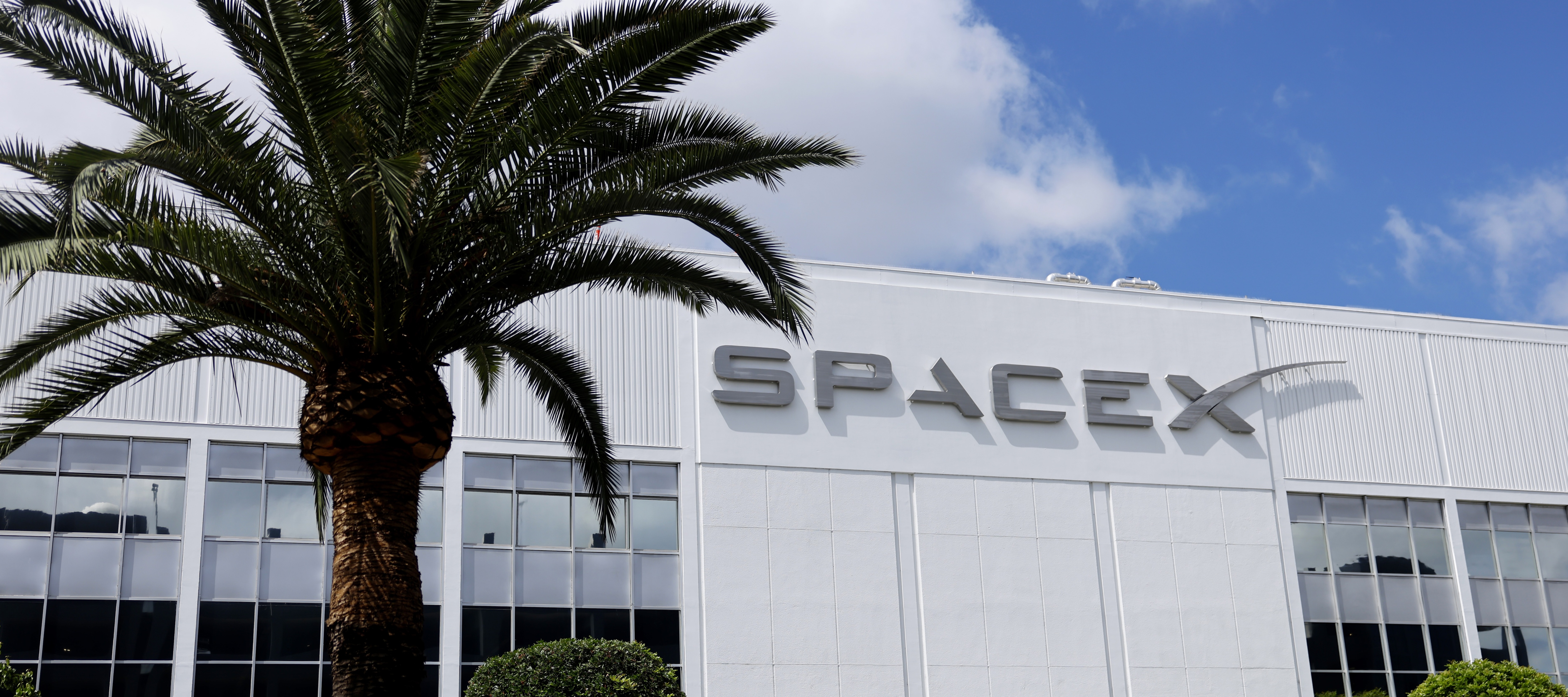 The SpaceX logo is displayed at a SpaceX facility on April 2, 2026 in Hawthorne, California.