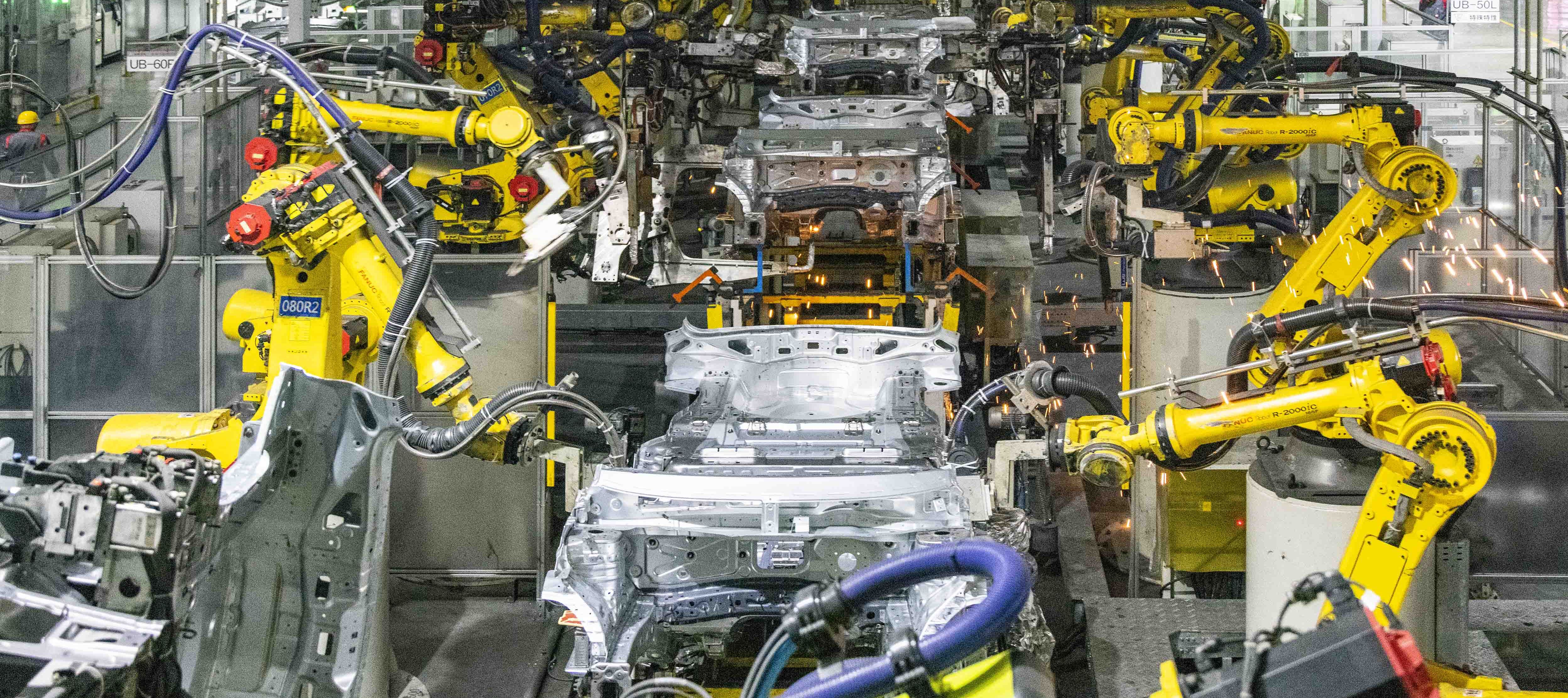 Robots weld cars at a car plant of a Chinese automaker.