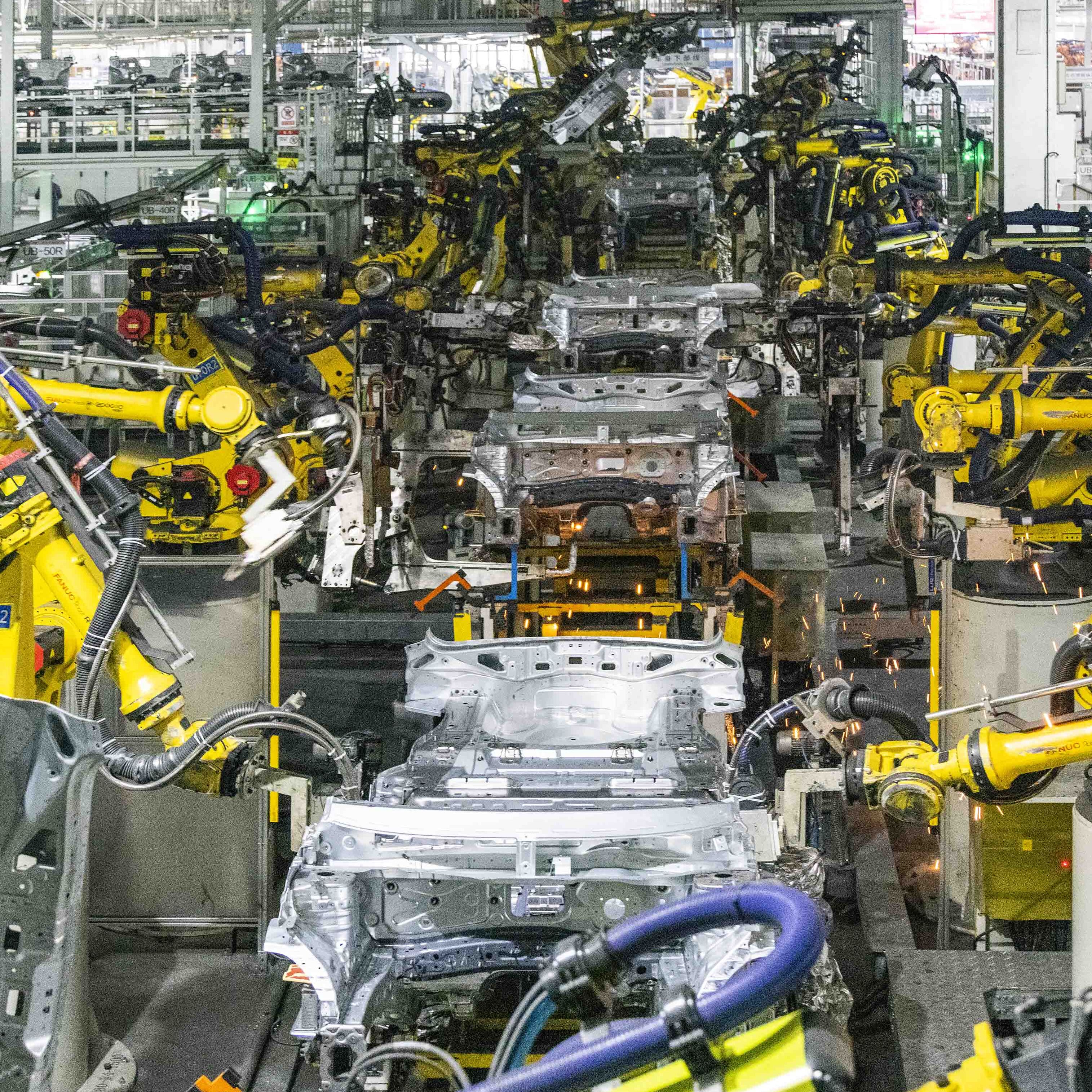 Robots weld cars at a car plant of a Chinese automaker.