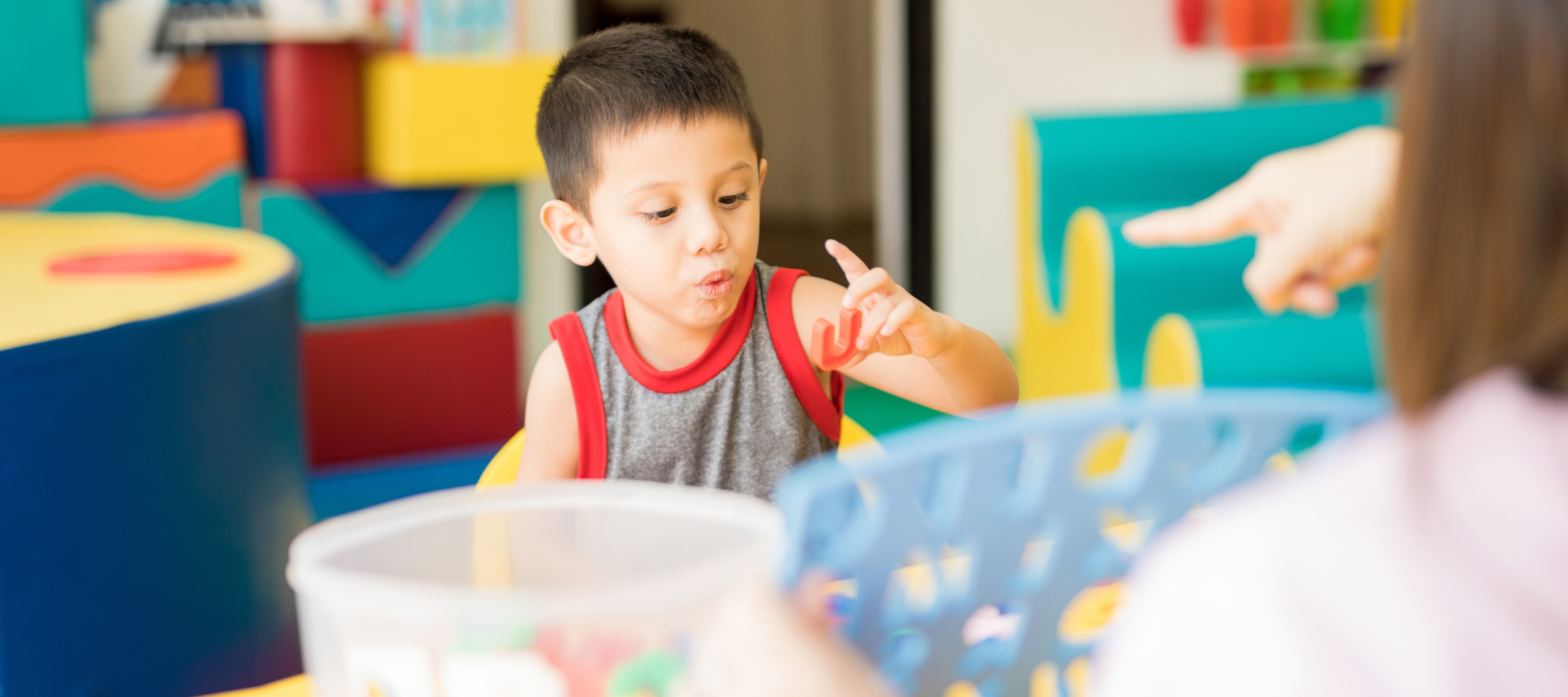 Toddler boy playing at daycare center