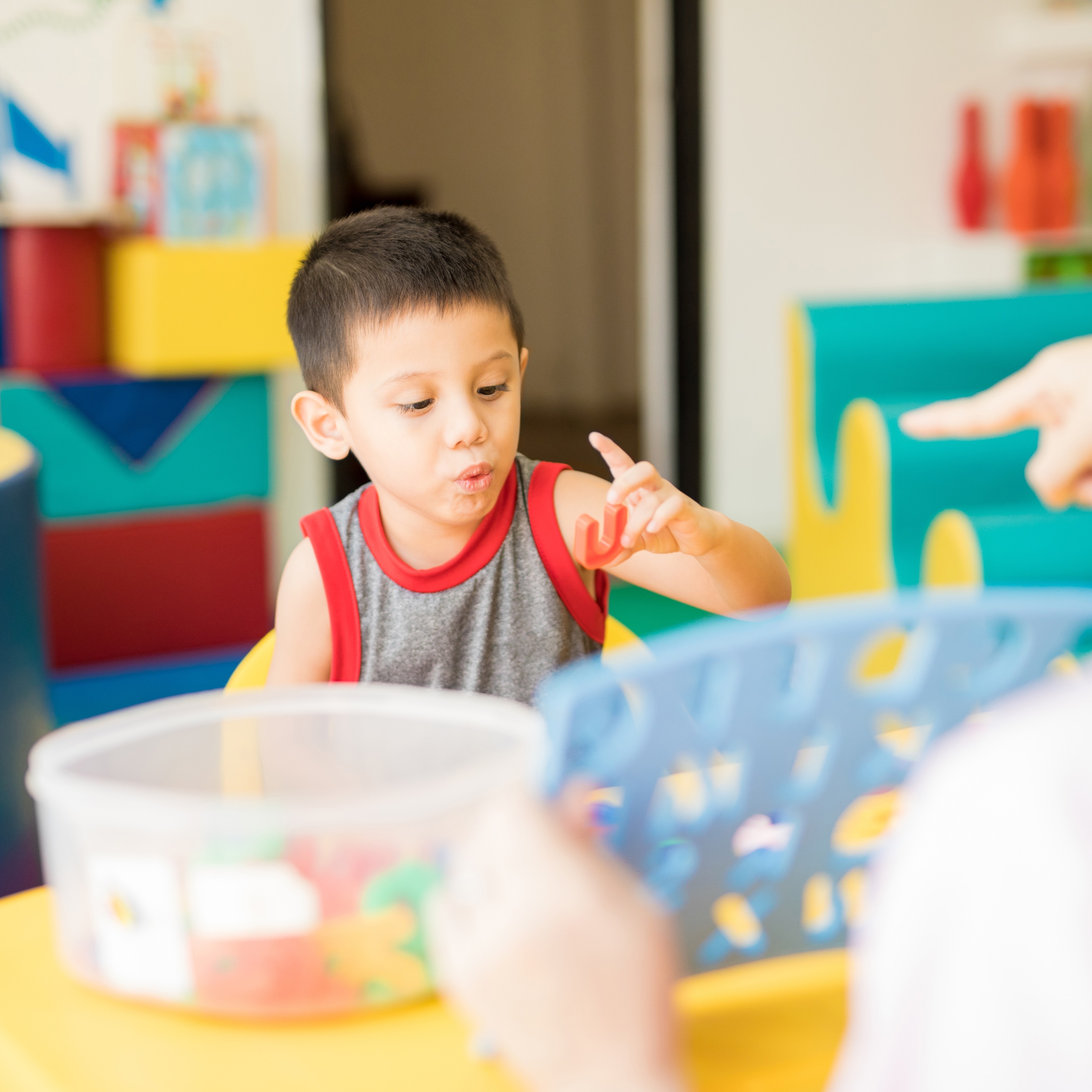 Toddler boy playing at daycare center